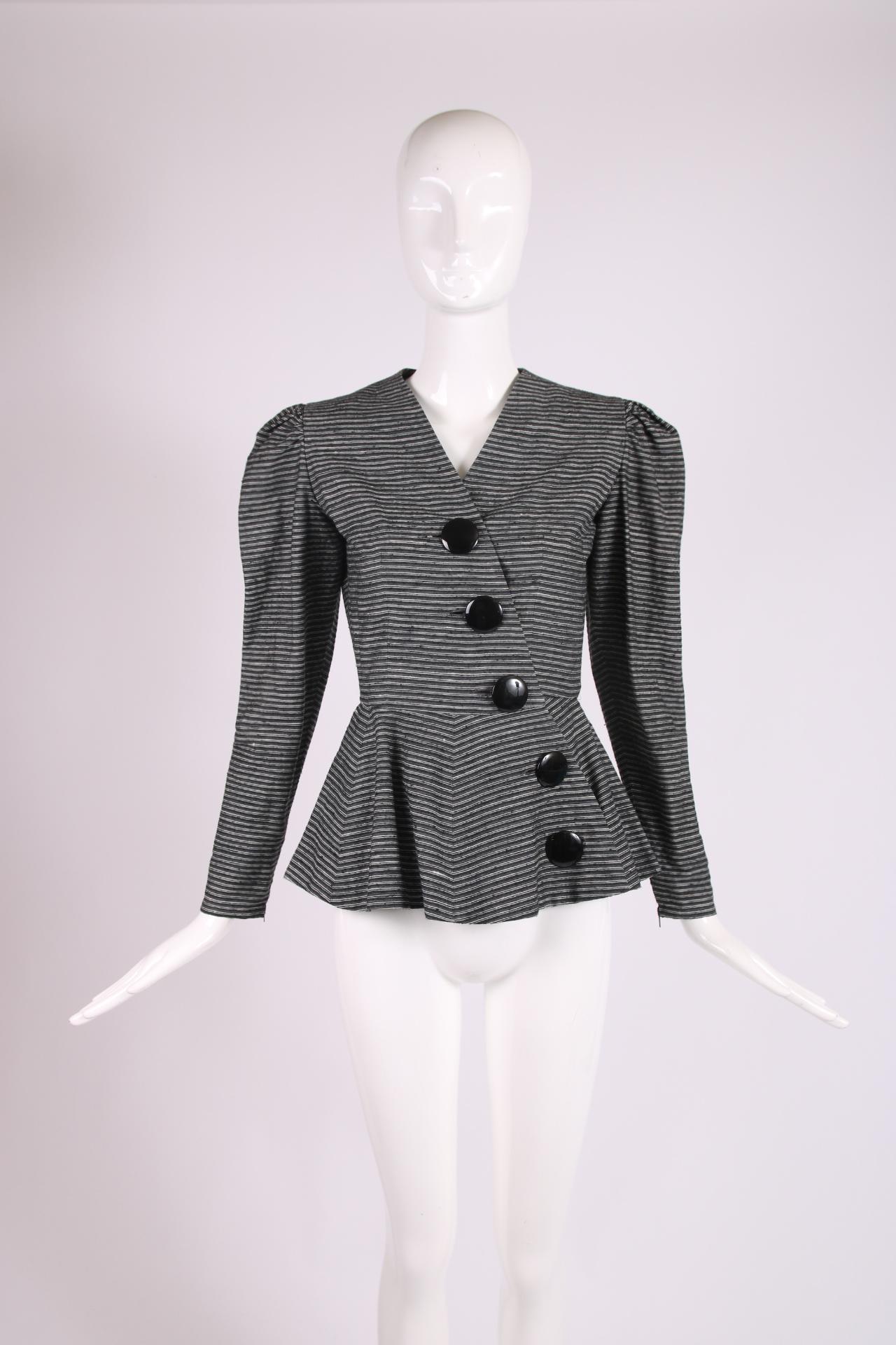 Vintage Lanvin black and white striped silk and cotton blend jacket with peplum waist and diagonal oversized black button closures. In excellent condition - size tag 38. See measurements.

Shoulders - 14