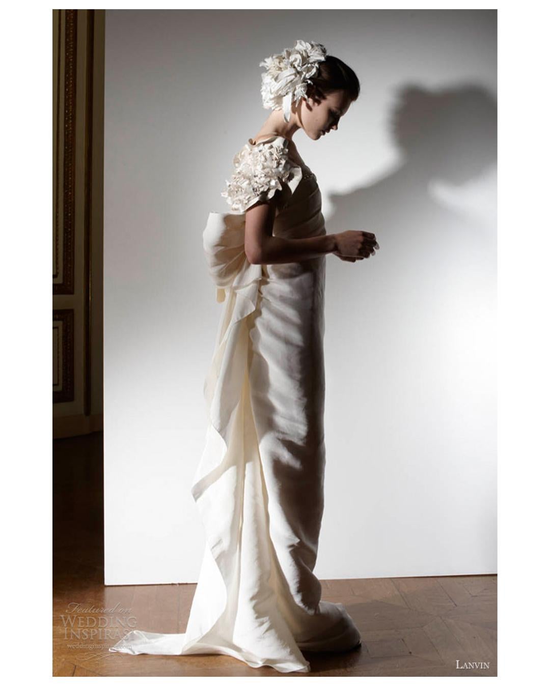 LOVE LALI Vintage

This is a truly beautiful gown from Lanvin's 2013 Blanche collection by Alber Elbaz. Though it is a wedding gown, this could also quite easily be worn as an evening dress. 
The colour is a gorgeous creamy ivory and is made from