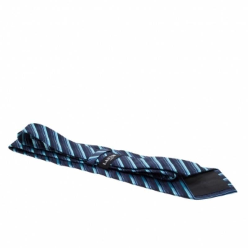 This tie from Lanvin is what every man needs to have. Made of 100% silk, it features a diagonal striped pattern all over it. At the back, it has a brand label and a keeper loop. The tie is sure to add charm to your suit and is perfect for all formal