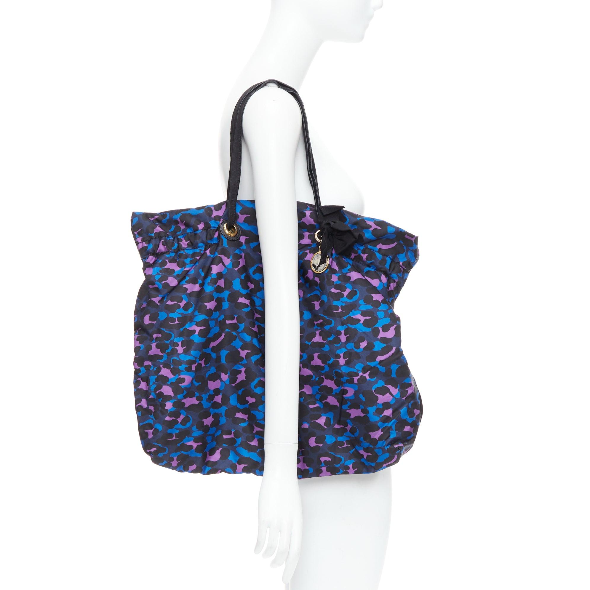 LANVIN blue purple leopard print black bow strap shoulder tote bag
Reference: SNKO/A00506
Brand: Lanvin
Designer: Alber Elbaz
Material: Fabric
Color: Purple, Blue
Pattern: Leopard
Closure: Drawstring
Lining: Black Fabric
Extra Details: Lanvin tote