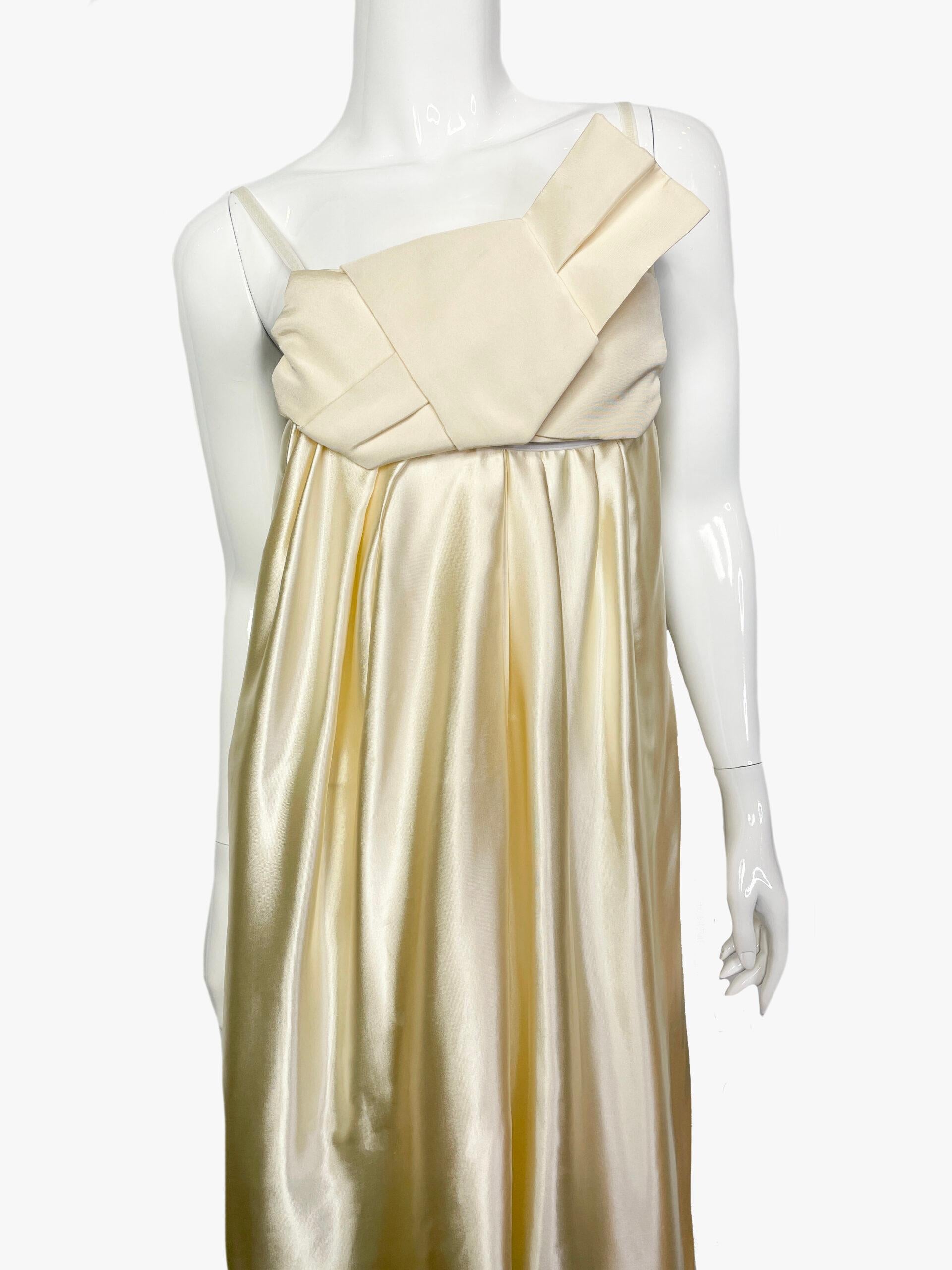 Silk dress by Lanvin, 2006 collection. Loose fit, Spaghetti straps, bow accent draping on the chest.

Additional information:
Fabric: 100% silk
Size: 38/M
Condition: Very good
........Additional information ........

- Photo might be slightly
