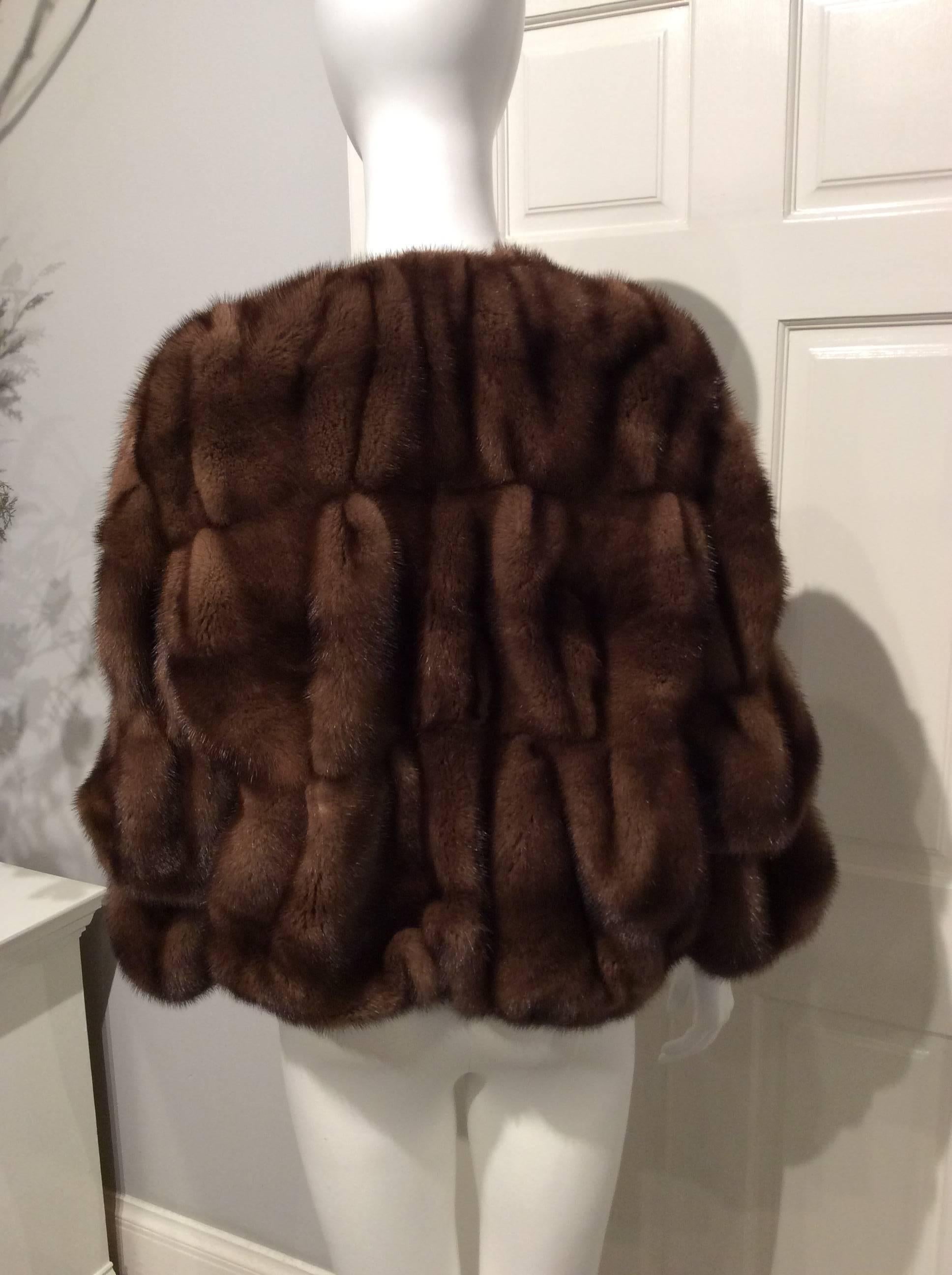 Lanvin chestnut brown mink collarless jacket from the 2005 Winter Collection.
 The pelts are sewn in tiers that make soft folds in the back and then gather slightly at the bottom. 
On the 3/4 length sleeves the tiers fold over to create additional