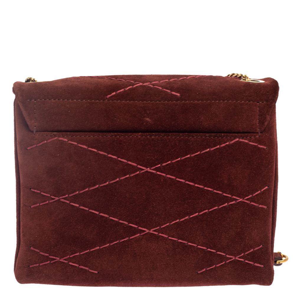 Sophistication and a good aesthetic are what Lanvin handbags have to offer. This shoulder bag does that perfectly and will carry all your everyday essentials with ease. Crafted from plush suede, this burgundy bag has a front flap, a shoulder strap,