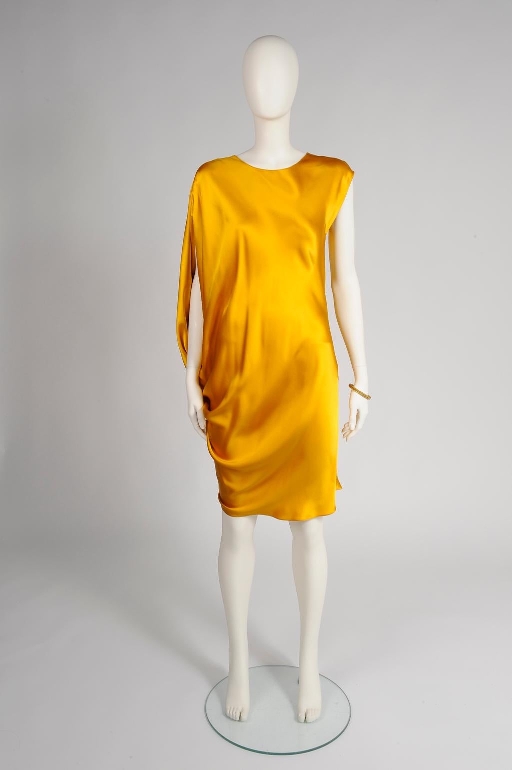 Impossible to miss, FW2012 Lanvin's vibrant sunny flower color cocktail is made for those who love to turn heads ! Cut from lustrous silk-satin, it features a round neckline and refined drape effect on the left side. Unlined, it is labeled a French