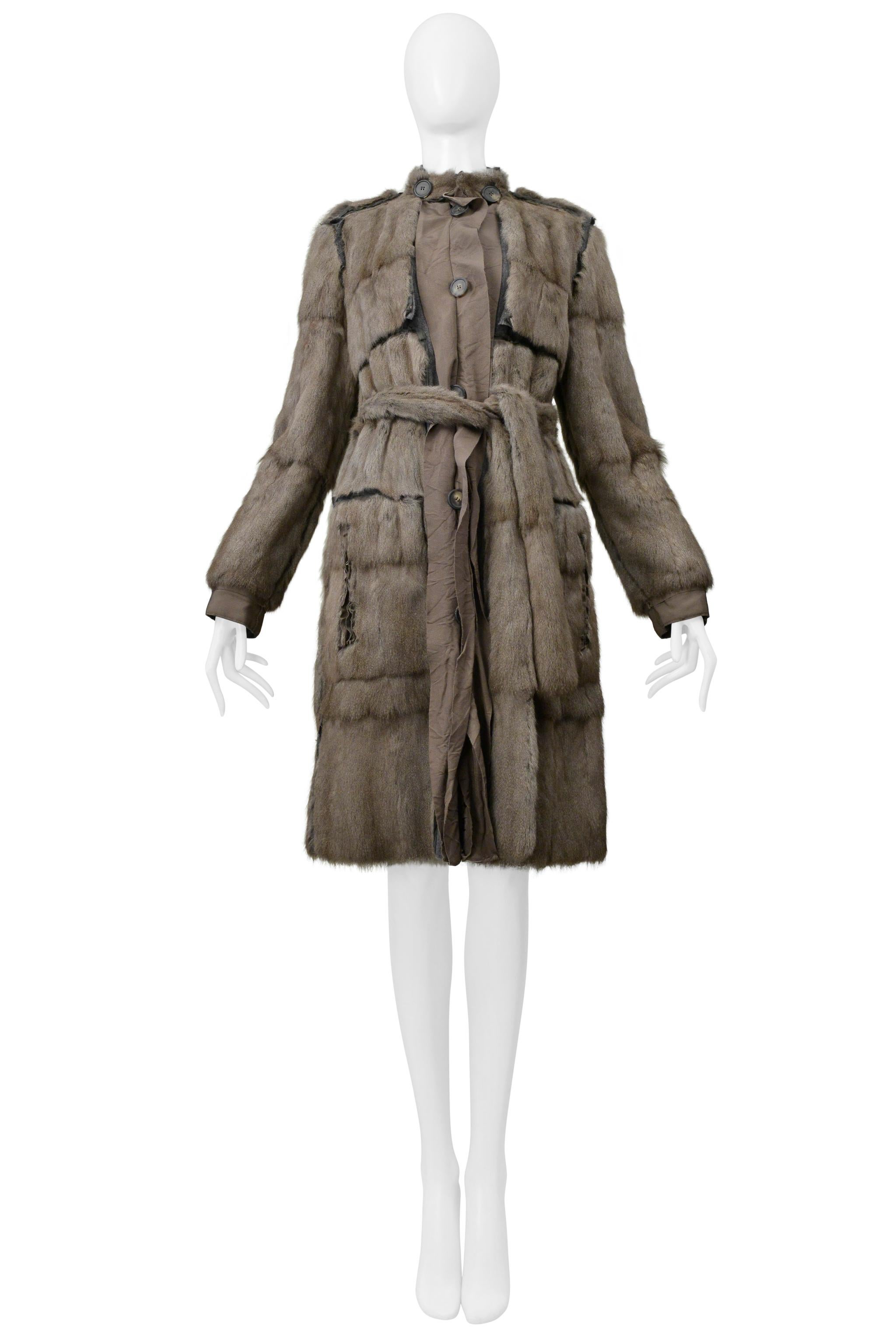 Resurrection Vintage is excited to offer a stunning Lanvin grey squirrel fur coat featuring iconic grosgrain ribbon trim, button front closure, side pockets with zippers, military details, Lanvin signature lining, and fur belt. 

Lanvin

Designed By