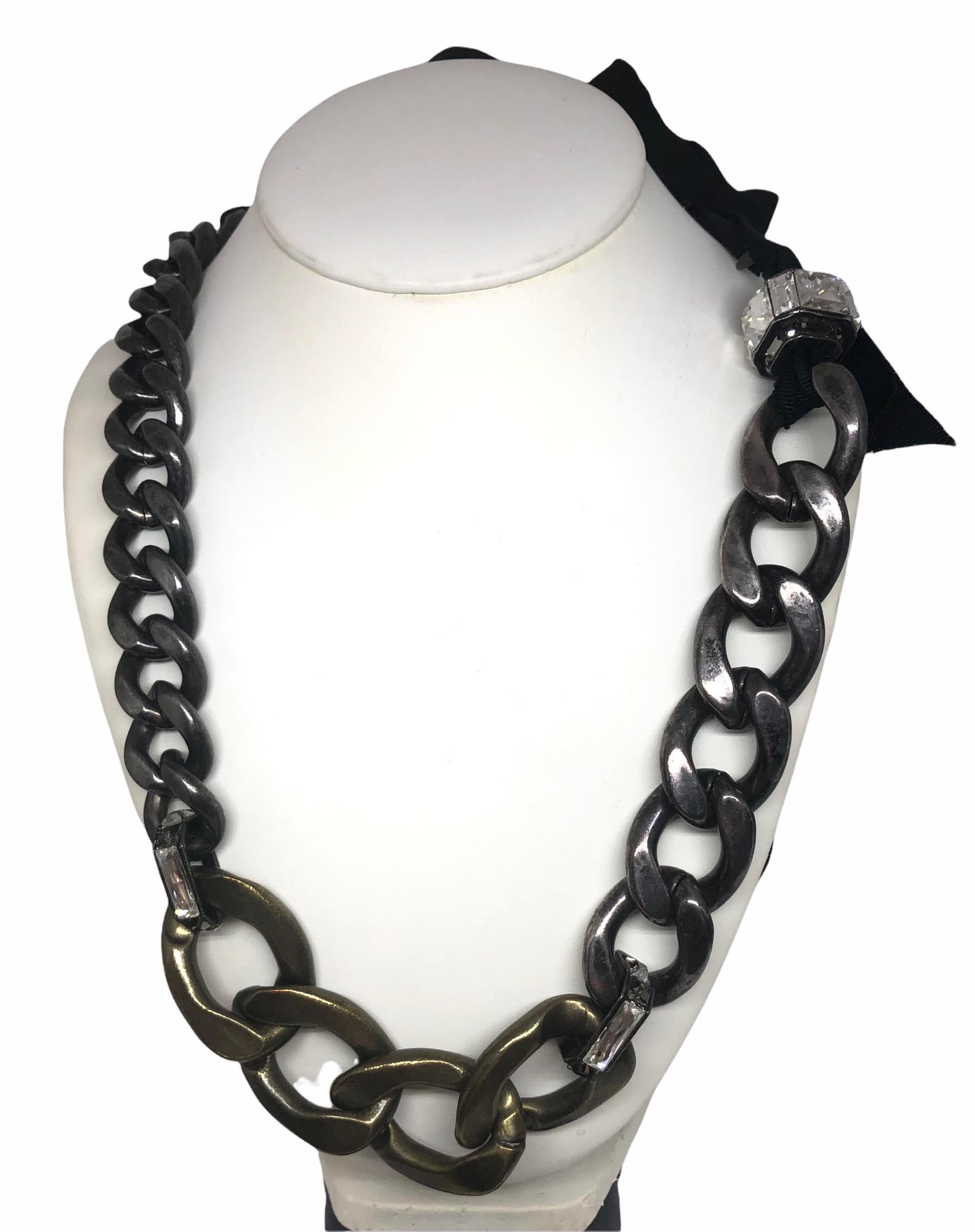 This gorgeous pre-owned and stunning necklace from the house of Lanvin during Albert Elbaz's presence as the Artistic Director, is now a collector item.
It is made of pewter gourmette links chain and crystal pieces with a black grosgrain for