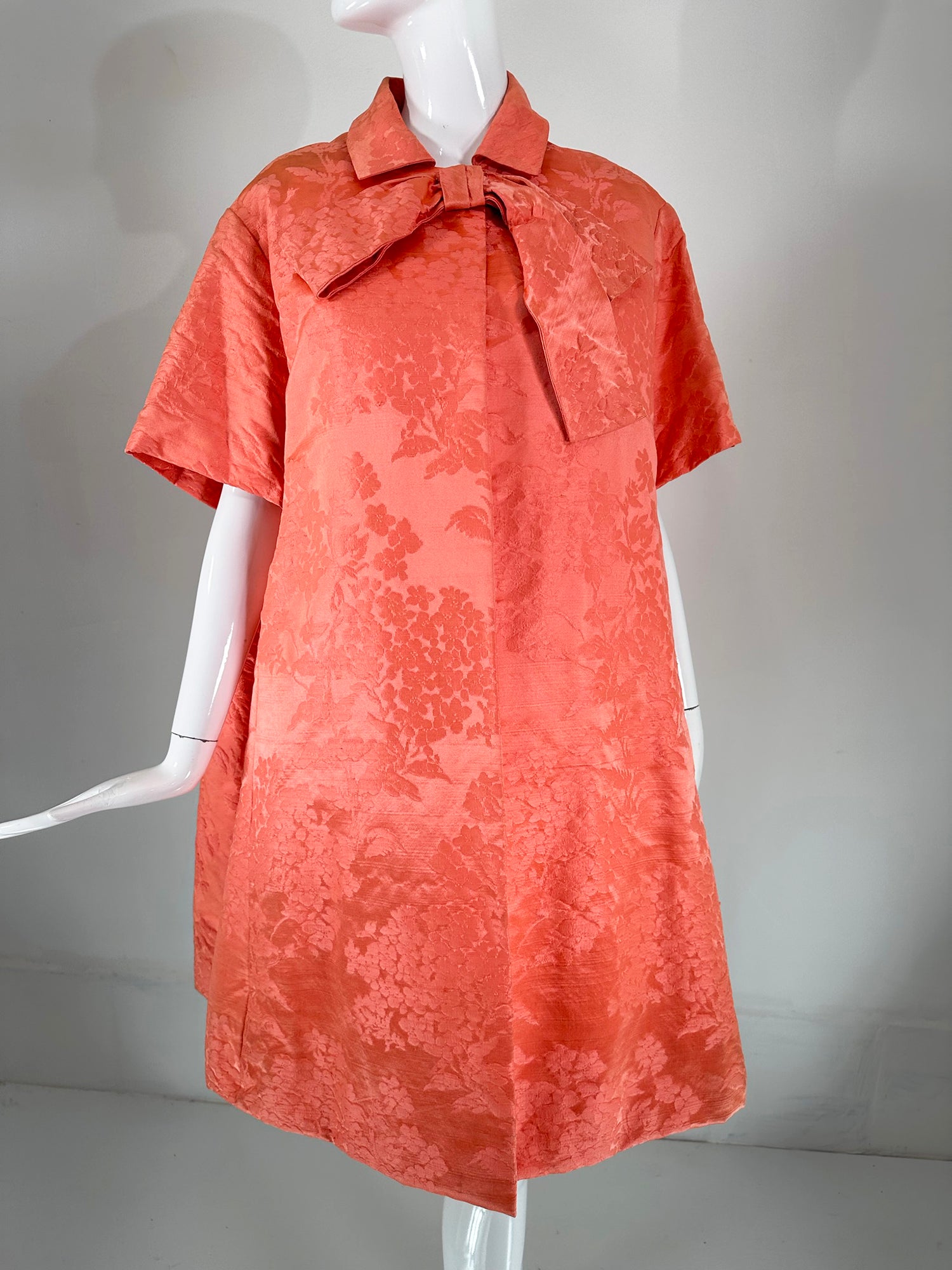 Lanvin-Castello Haute Couture dress & coat ensemble in bright coral silk brocade from the 1950s. Lanvin is the oldest French fashion house founded by Jeanne Lanvin in Paris in 1889 upon finishing her apprenticeship in millinery. 
She created a