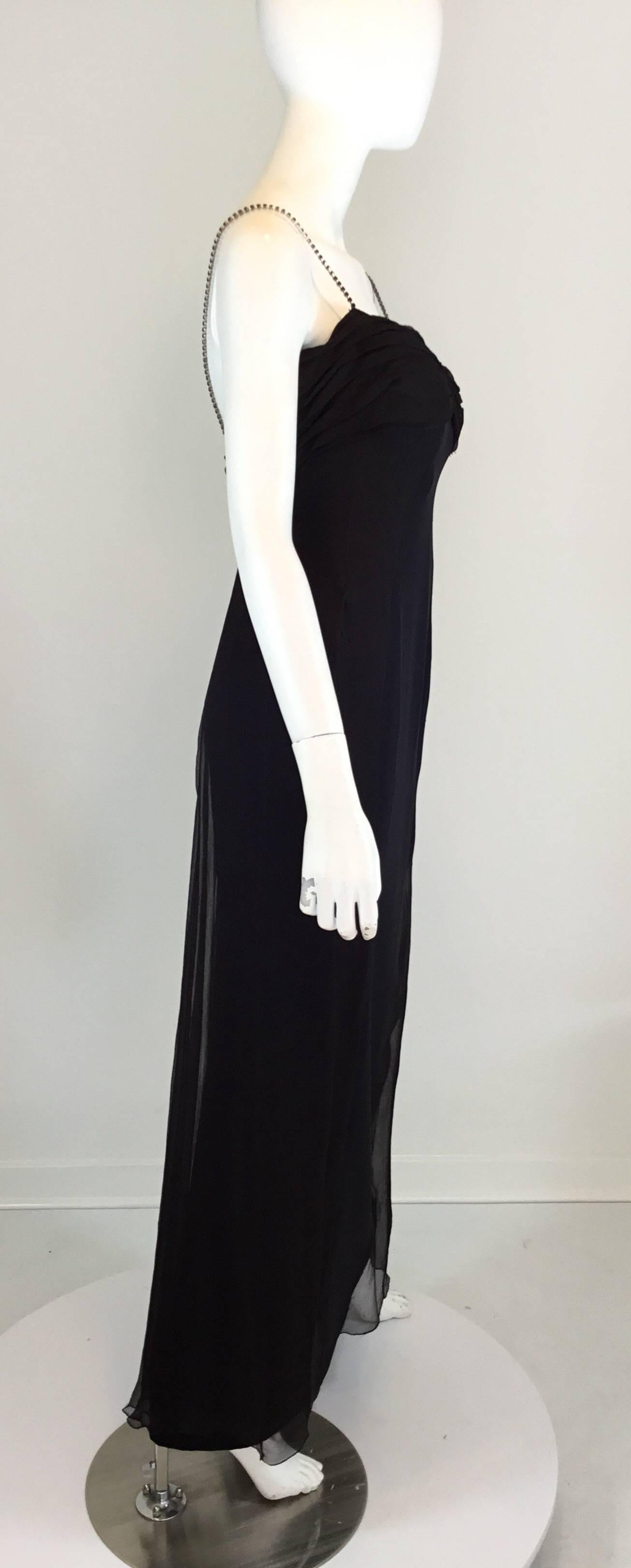 Vintage 1970's Lanvin dress features a silk chiffon bust and side panel with rhinestone encrusted shoulder straps, and a back zipper closure. Dress is fully lined, labeled size 42, made in France. 59% acetate and 41% silk. Measurements are as