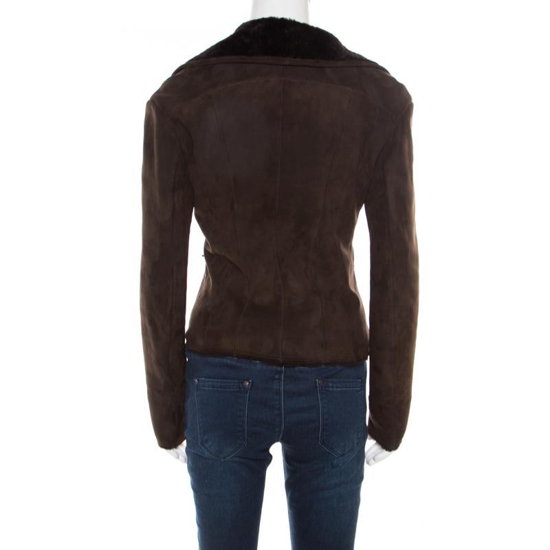This fabulous biker jacket from Lanvin is chic, stylish and very modern! The chocolate brown creation is made of 100% lambskin leather and features a front concealed zip closure. It has wide collars that have been lined with 100% shearling, thus