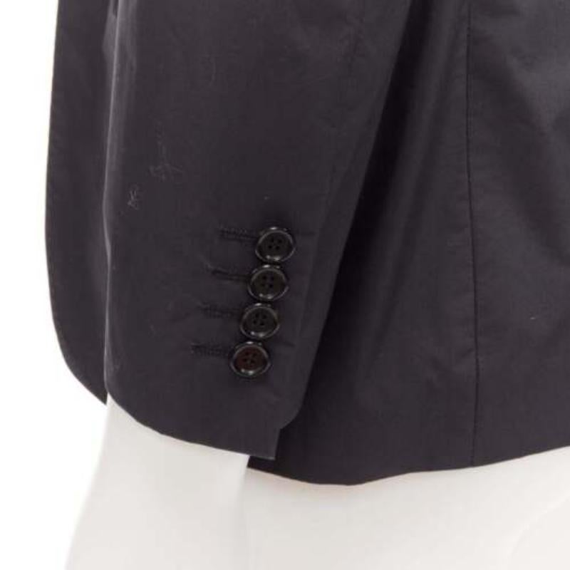 LANVIN dark grey cotton blend nylon minimal single breast suit blazer EU44 XS
Reference: CNLE/A00254
Brand: Lanvin
Designer: Alber Elbaz
Material: Cotton, Blend
Color: Grey
Pattern: Solid
Closure: Button
Lining: Black Fabric
Made in: