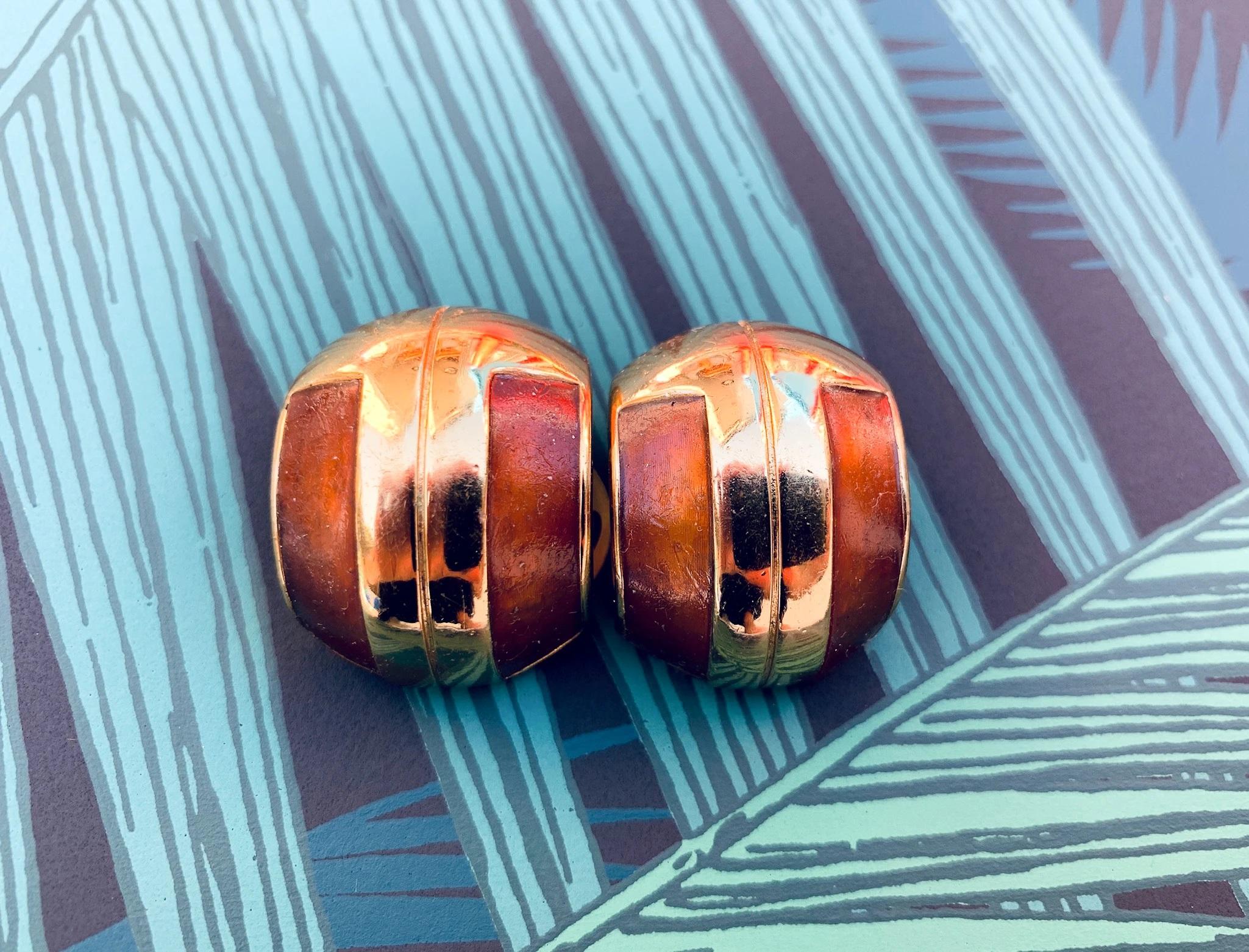 Lanvin 1970s Vintage Statement Clip on Earrings

Incredible statement earrings from the House of Lanvin with classic 70s modernist styling

Detail
-Made in Cast from gold plated metal
-Feature the iconic Lanvin double L logo
-Rich mahogany enamel