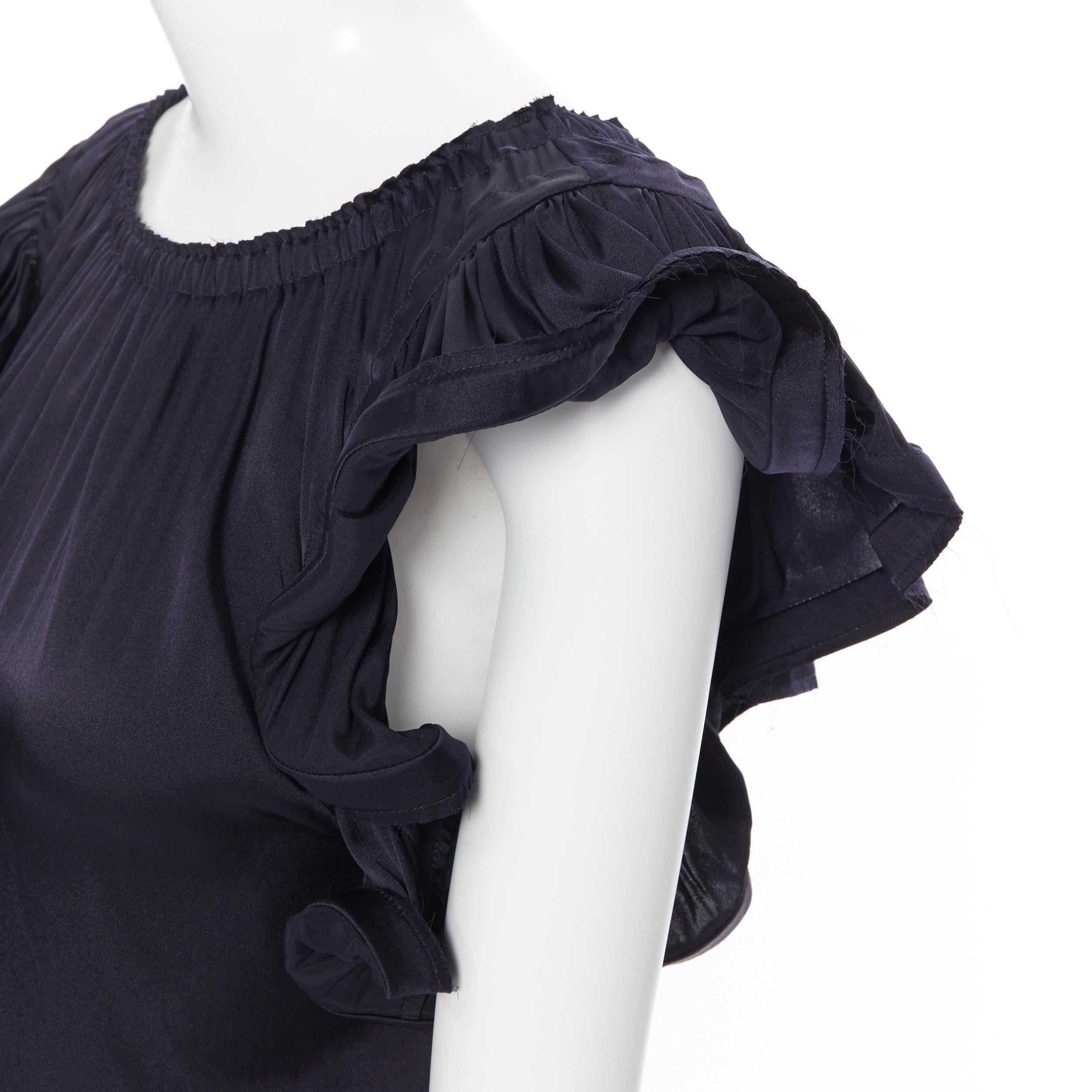LANVIN Elbaz 2008 stretch silk elasticated neckline ruffle sleeve top FR34 XS
Brand: Lanvin
Designer: Alber Elbaz
Collection: Spring Summer 2008
Model Name / Style: Ruffle top
Material: Silk
Color: Navy
Pattern: Solid
Extra Detail: Elasticated