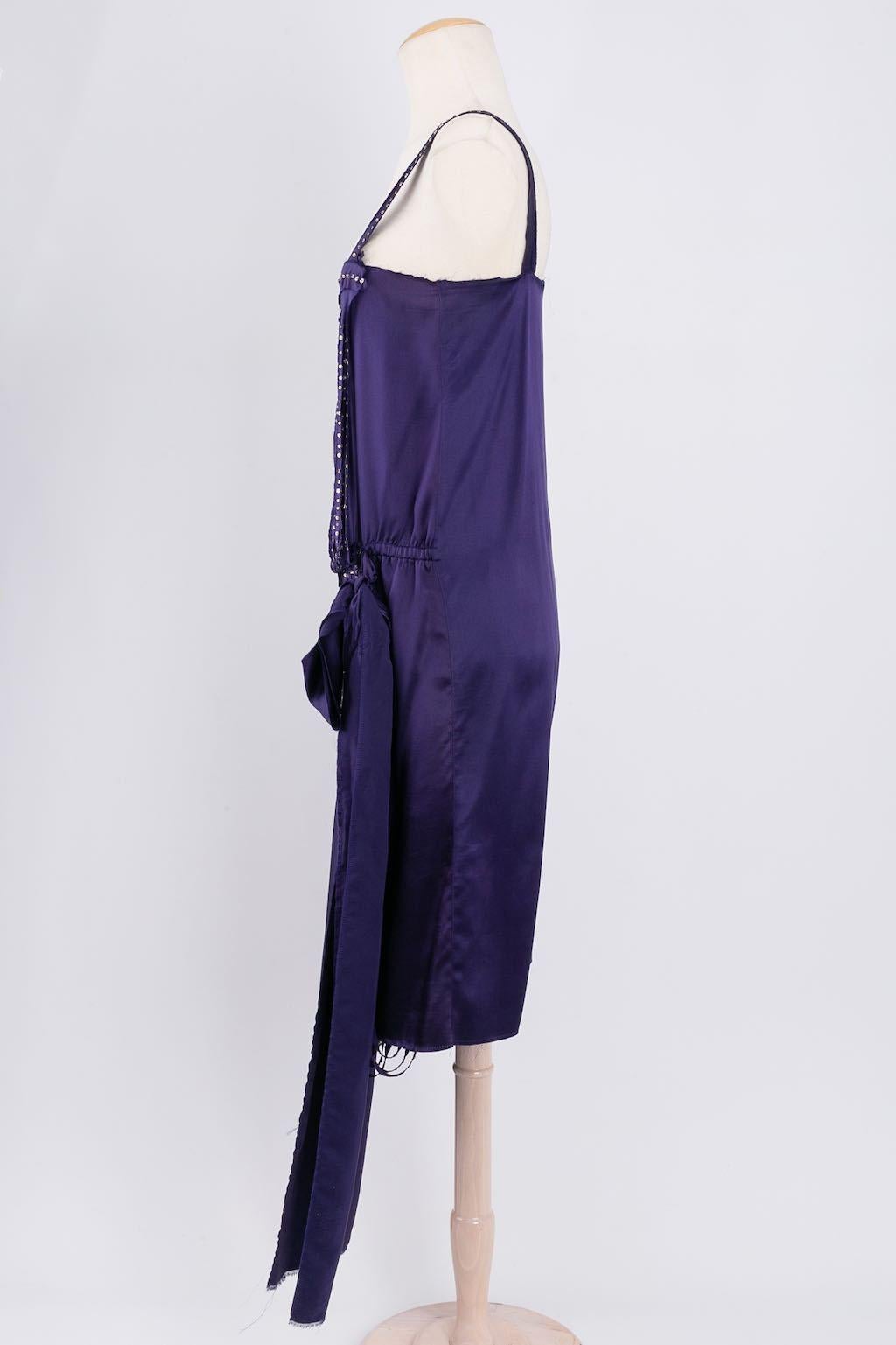 Lanvin - Dress composed of purple silk embellished with rhinestones. No composition or size tag, it fits a size 38FR.
Winter Collection, 2004


Additional information: 
Dimensions: 
Bust: 43 cm (16.92