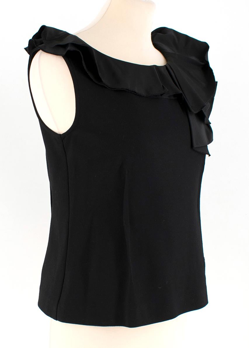 Lanvin En Bleu Black Taffeta Ruffled Jersey Top

- Taffeta ruffled neck
- Sleeveless
- Stretch fabric
- Zip fastening at back 

Please note, these items are pre-owned and may show some signs of storage, even when unworn and unused. This is reflected
