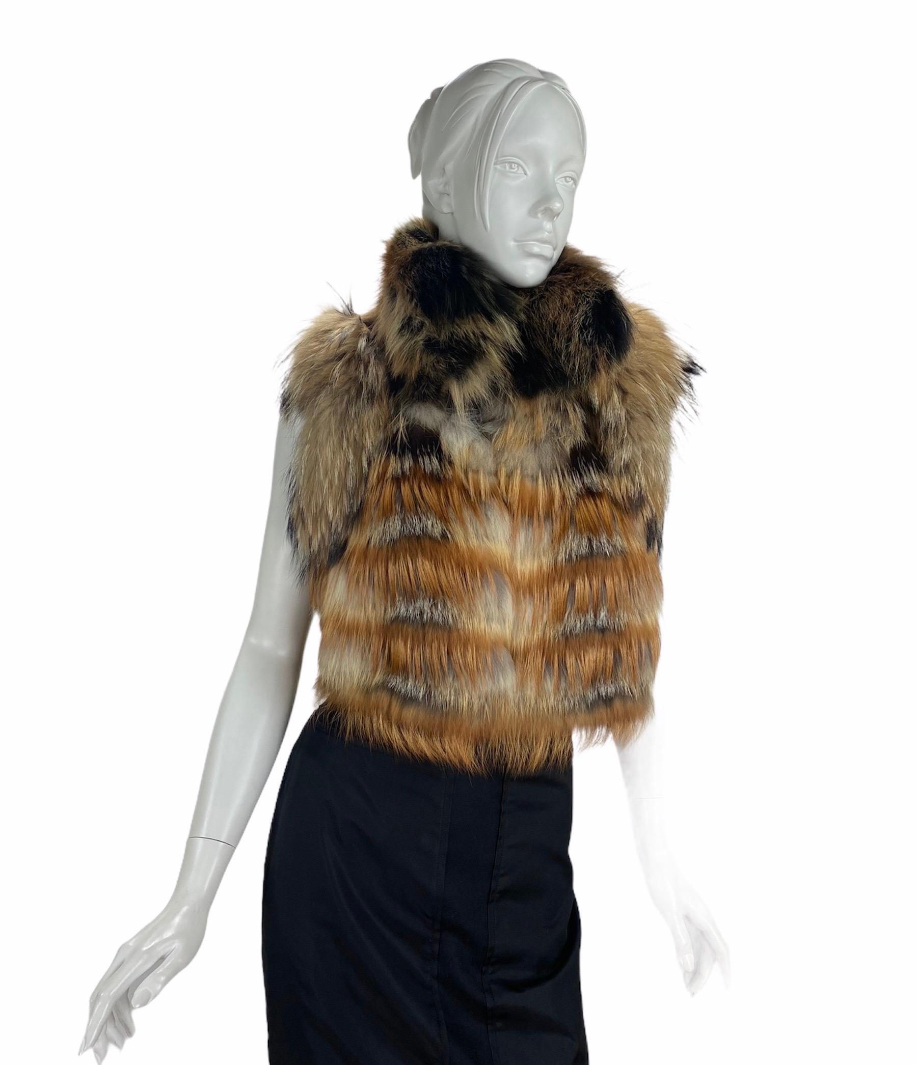 LANVIN Fourrure Fox Fur Sleeveless Vest Jacket
Approximate size S
Fox fur, Signature Silk Lining, Two Buttons Closure. Bust 36 inches, Waist 34”, Length 17”.
Retail price is $9,599.00
Excellent condition.