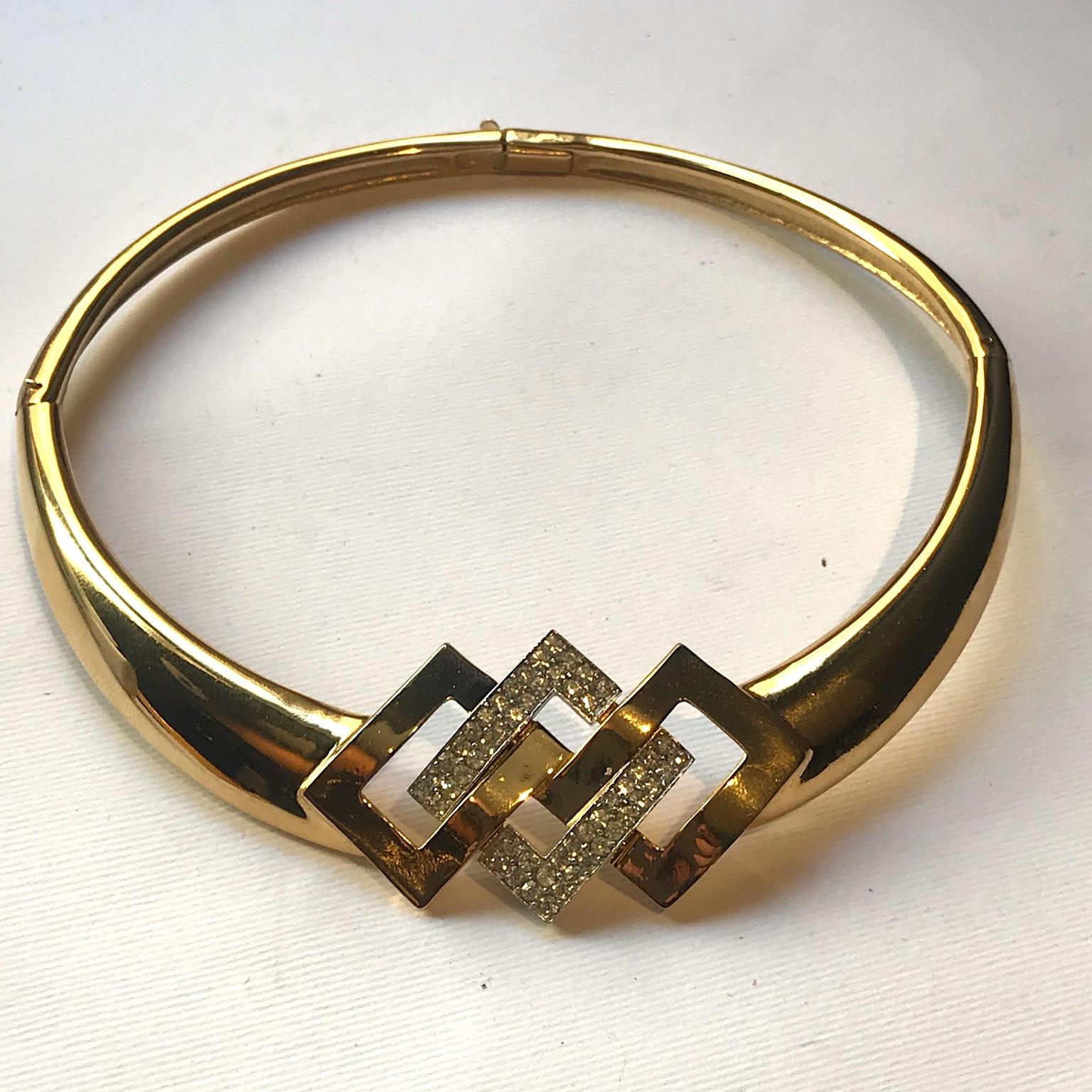 A late 1970s to 1980s rigid style collar necklace by fashion house Lanvin of France. The necklace features a central geometric design of three interlocking rectangles turned on a point. The center rectangle is rhodium plated and set with pave'