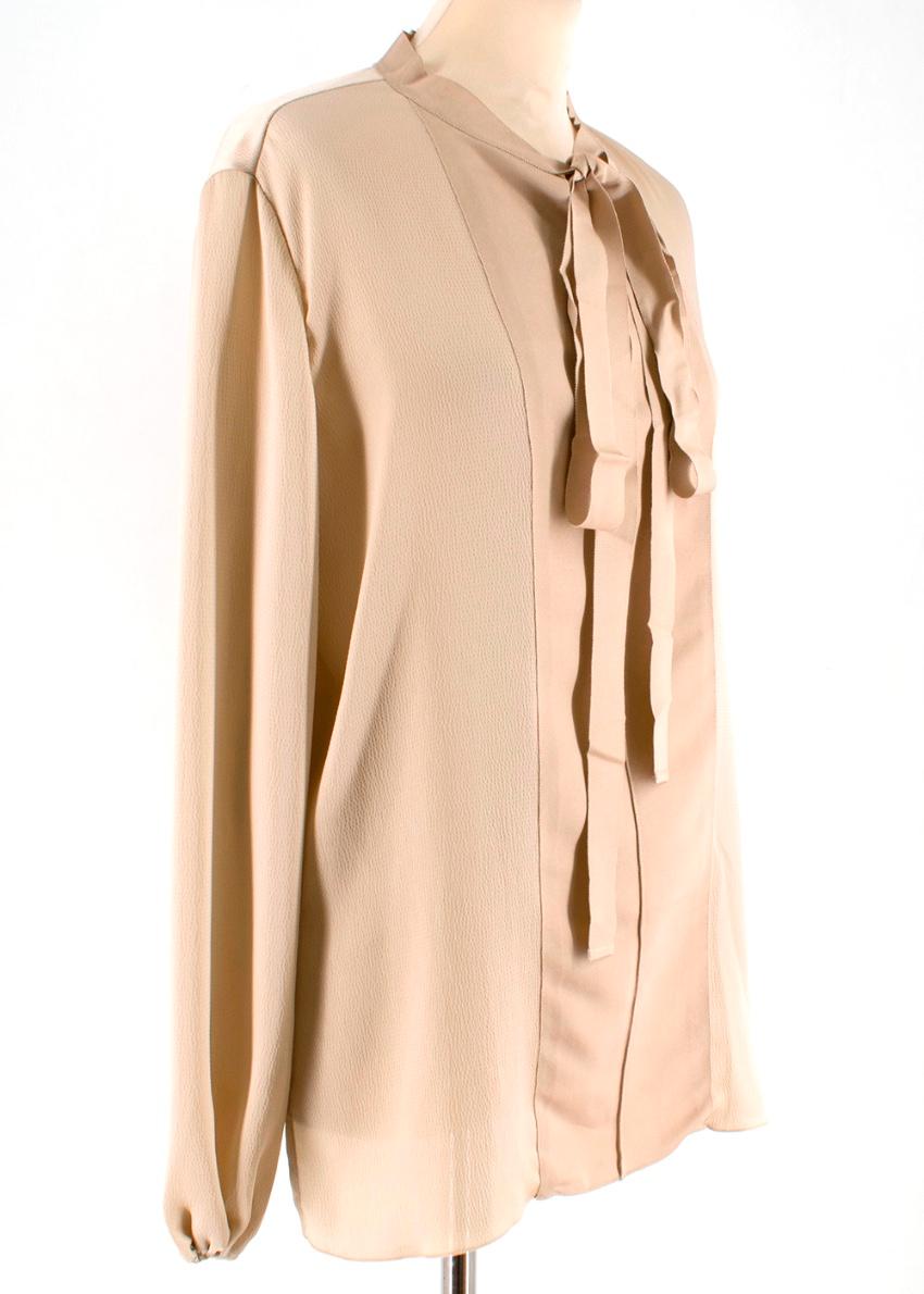 Lanvin Beige Textured Pussy Bow Blouse.    RRP £1135.00

- Grained Texture to Outer 
- Ribbon detail to bow and front 
- Open Neckline 
- Long-Sleeved
- Rounded Hemline at Back 
- elasticated cuffs


Materials 
100% Polyester 

Dry Clean Only 

Made