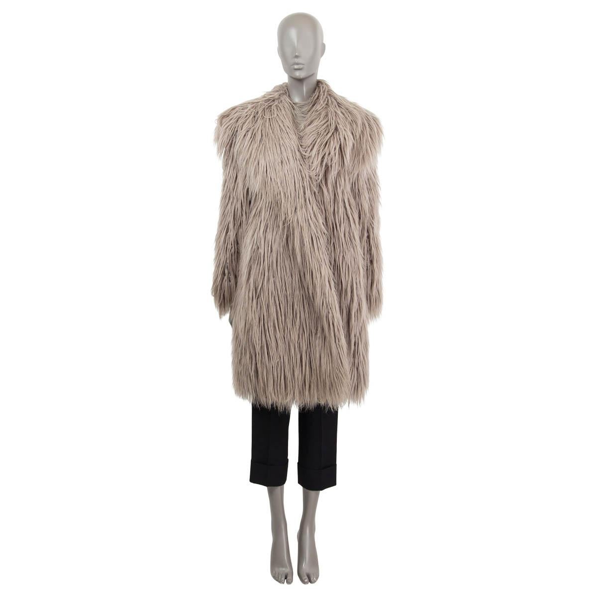 100% authentic Lanvin shaggy faux fur long coat in light grey acrylic (70%) and polyester (30%). With wide notch collar and two slit pockets. Closes with front snaps. Lined with grey silk (100%). Has been worn and is in excellent condition.