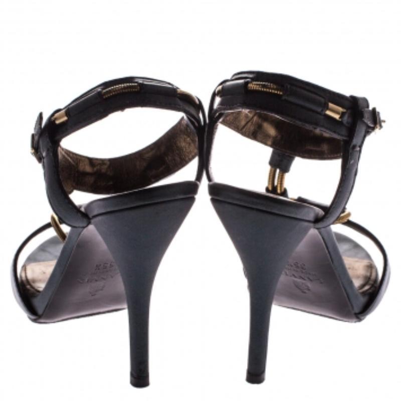 These sandals from Lanvin are simply amazing and wait for you to make them yours! The dark green sandals are crafted from leather and feature elastic metal strings as T straps. They flaunt buckle fastenings at the ankles, high heels and comfortable