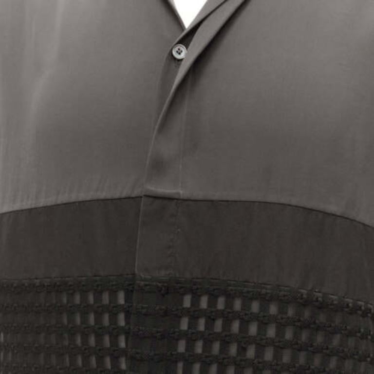 LANVIN grey black silky twill mix texture short sleeves dress shirt EU38/15 S
Reference: CNLE/A00287
Brand: Lanvin
Designer: Alber Elbaz
Material: Polyester
Color: Grey, Black
Pattern: Solid
Closure: Button
Made in: Italy

CONDITION:
Condition: