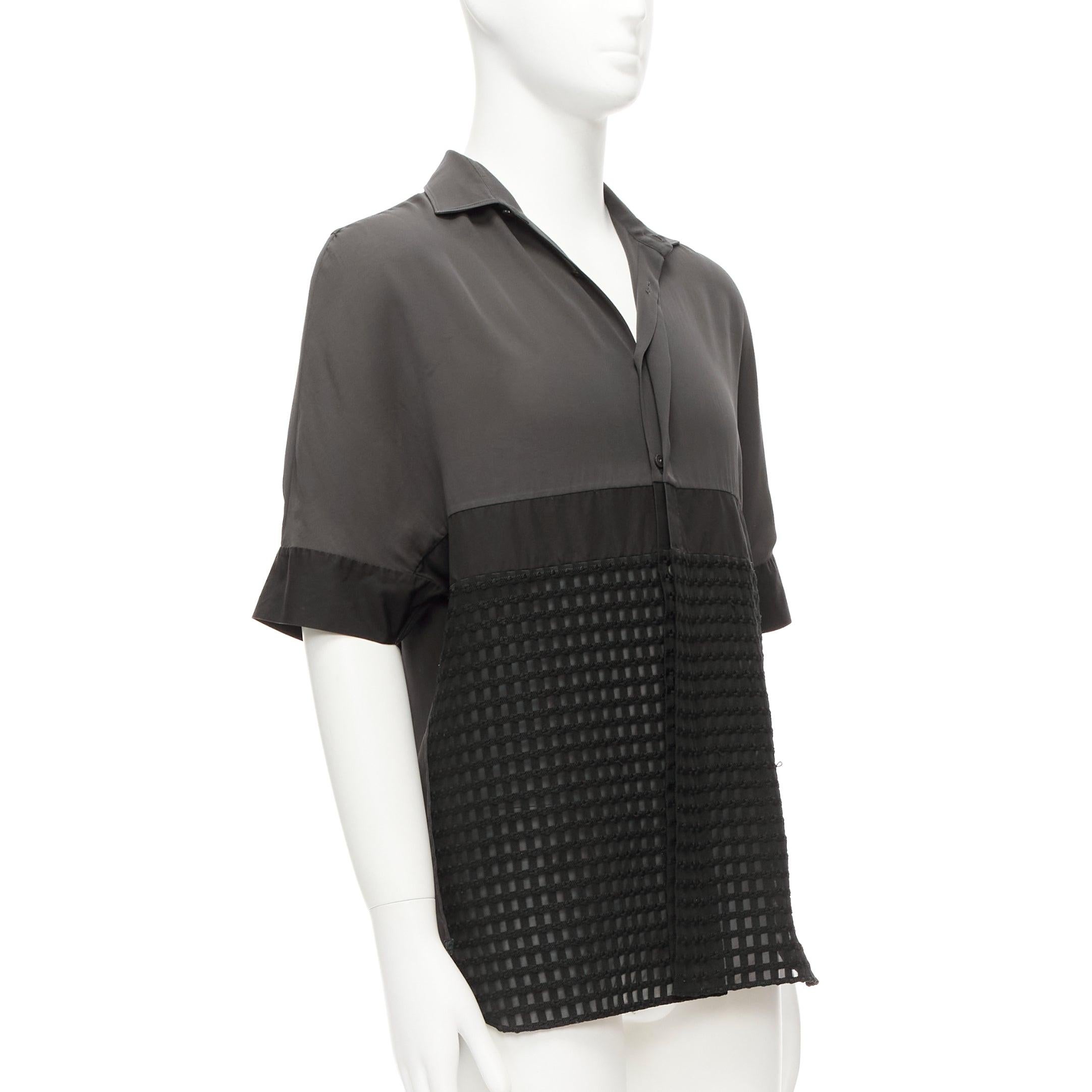 LANVIN grey black silky twill mix texture short sleeves dress shirt EU38/15 S
Reference: CNLE/A00287
Brand: Lanvin
Designer: Alber Elbaz
Material: Polyester
Color: Grey, Black
Pattern: Solid
Closure: Button
Made in: Italy

CONDITION:
Condition: