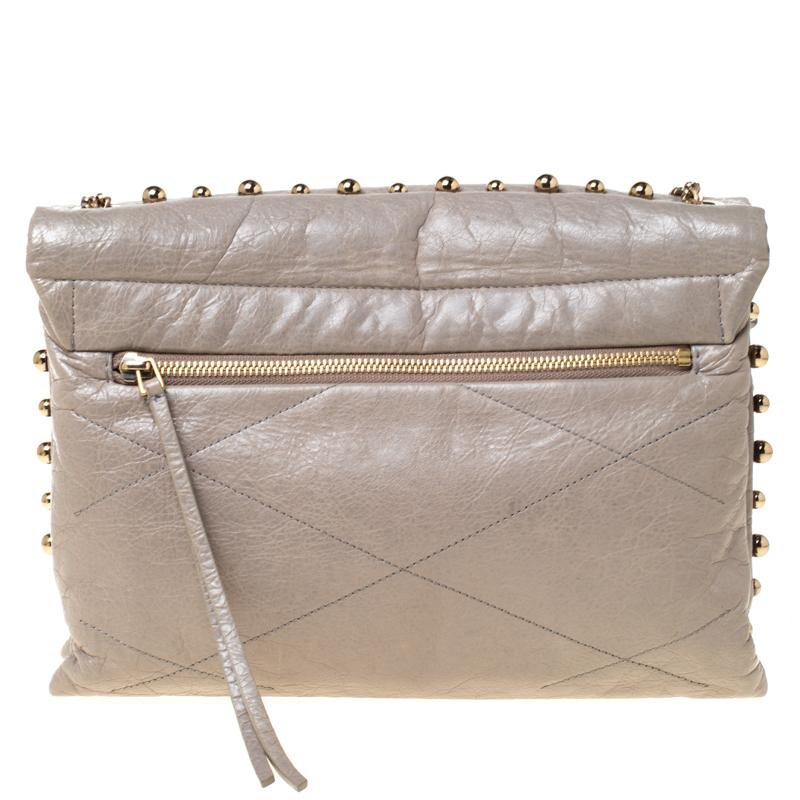 This Lanvin shoulder bag will carry all your everyday essentials with ease. Crafted from leather, this bag is accented with sugar beads and the brand label on the front. The bag is completed with a shoulder strap and a nylon interior.

Includes: The