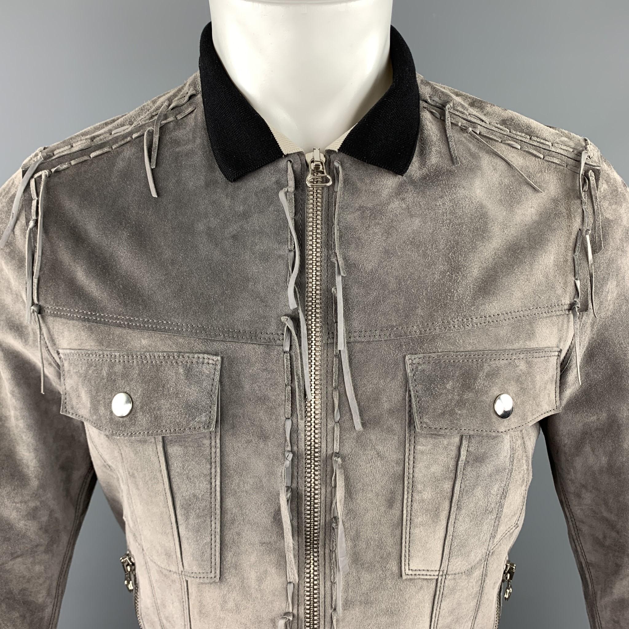 LANVIN jacket comes in gray suede with snap chest pockets, zip side pockets, black and beige striped knit collar, and fringe trim throughout. Made in Italy.

Excellent Pre-Owned Condition.
Marked: IT 48

Measurements:

Shoulder: 16 in.
Chest: 40