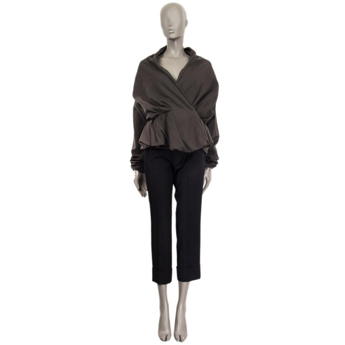 100% authentic Lanvin peplum asymmetric blazer in gray wool (96%) and metal (4%). With thin gray shawl collar and two belt loops (belt missing). Closes with a hidden button and a concealed hook on the front. Sleeves are lined in gray silk. Has been