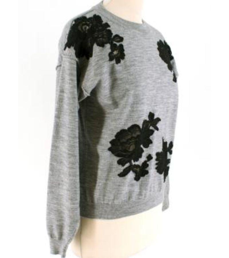 Lanvin Grey Wool Floral Lace Embellished Knit Sweater

- Wool knit sweater 
- Black lace embellishment to the front
- Round neckline 

Please note, these items are pre-owned and may show some signs of storage, even when unworn and unused. This is