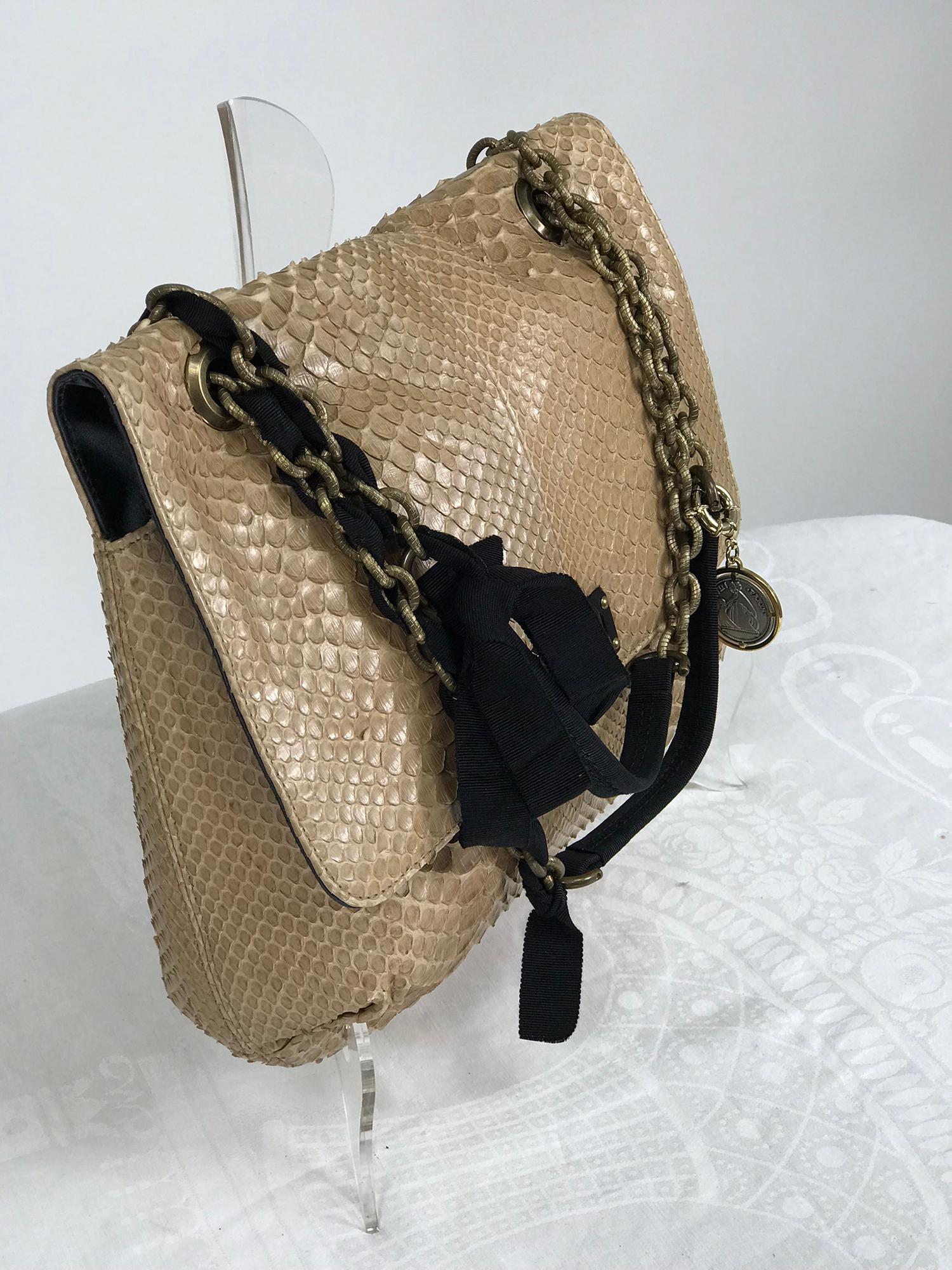 Lanvin Happy blond snakeskin with black faille trims and textured gold chain, black Lucite turn lock and plate with gold hardware. This beautiful bag is in very good pre owned condition, the combination of light and dark is a classic stand out.
The