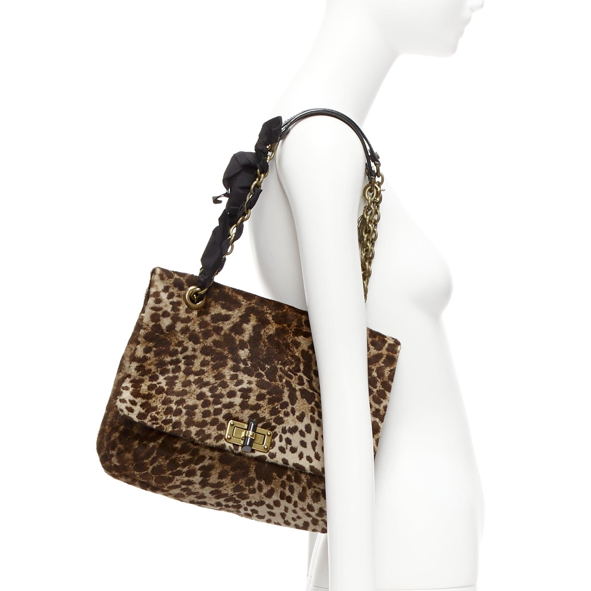 LANVIN Happy brown leopard print calfhair black ribbon chain shoulder bag
Reference: TGAS/D00973
Brand: Lanvin
Designer: Alber Elbaz
Model: Happy
Material: Pony Hair, Fabric, Leather
Color: Brown, Black
Pattern: Leopard
Closure: Turnlock
Lining: