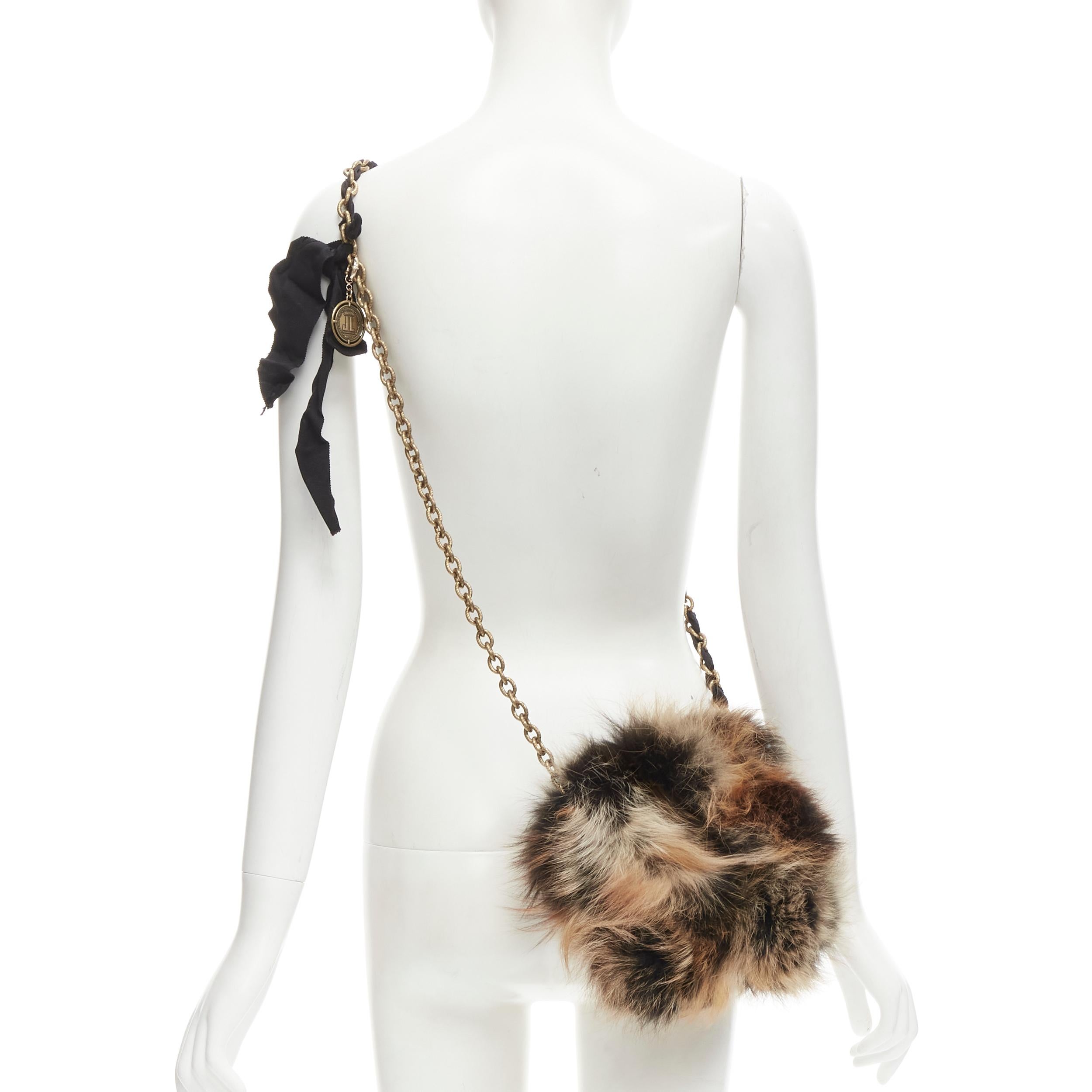 LANVIN Happy brown mixed fur turnlock flap ribbon gold chain crossbody bag
Brand: Lanvin
Model: Happy
Extra Detail: Tortoise resin turnlock flap. Gold-tone chain with grosgrain ribbon trim. Antique medallion coin charm. Black satin