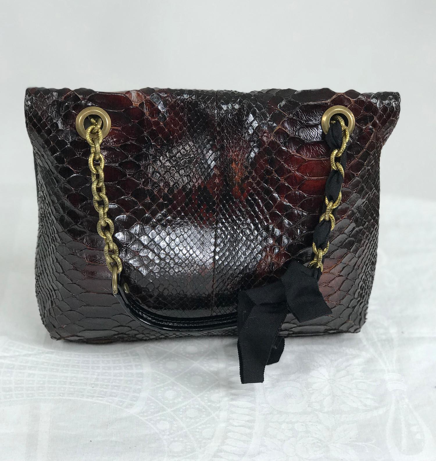 Lanvin Happy shoulder bag, red python with black faille trims and textured gold chain,black patent leather shoulder strap handles, black Lucite turn lock and plate with gold hardware. This beautiful bag is in very good pre owned condition. 
The bag