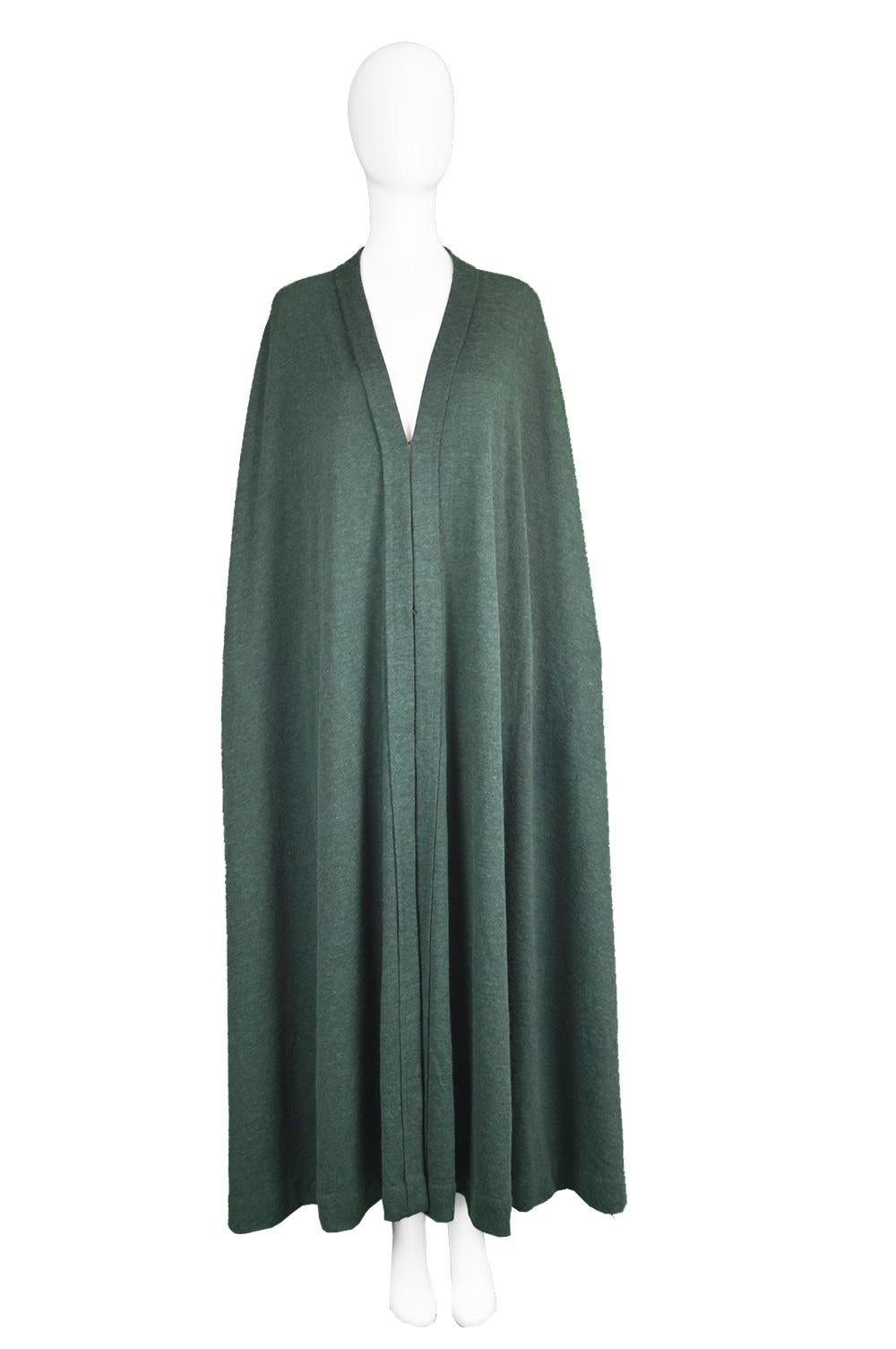 Lanvin Haute Couture Unstructured Green Wool Knit Maxi Cape Cloak, 1970s

Click 'CONTINUE READING' below to see size & description. 

Size: One Size fits most. 
Bust - Free
Waist - Free
Hips - Free
Length (Shoulder to Hem) - 52” / 132cm

Condition:
