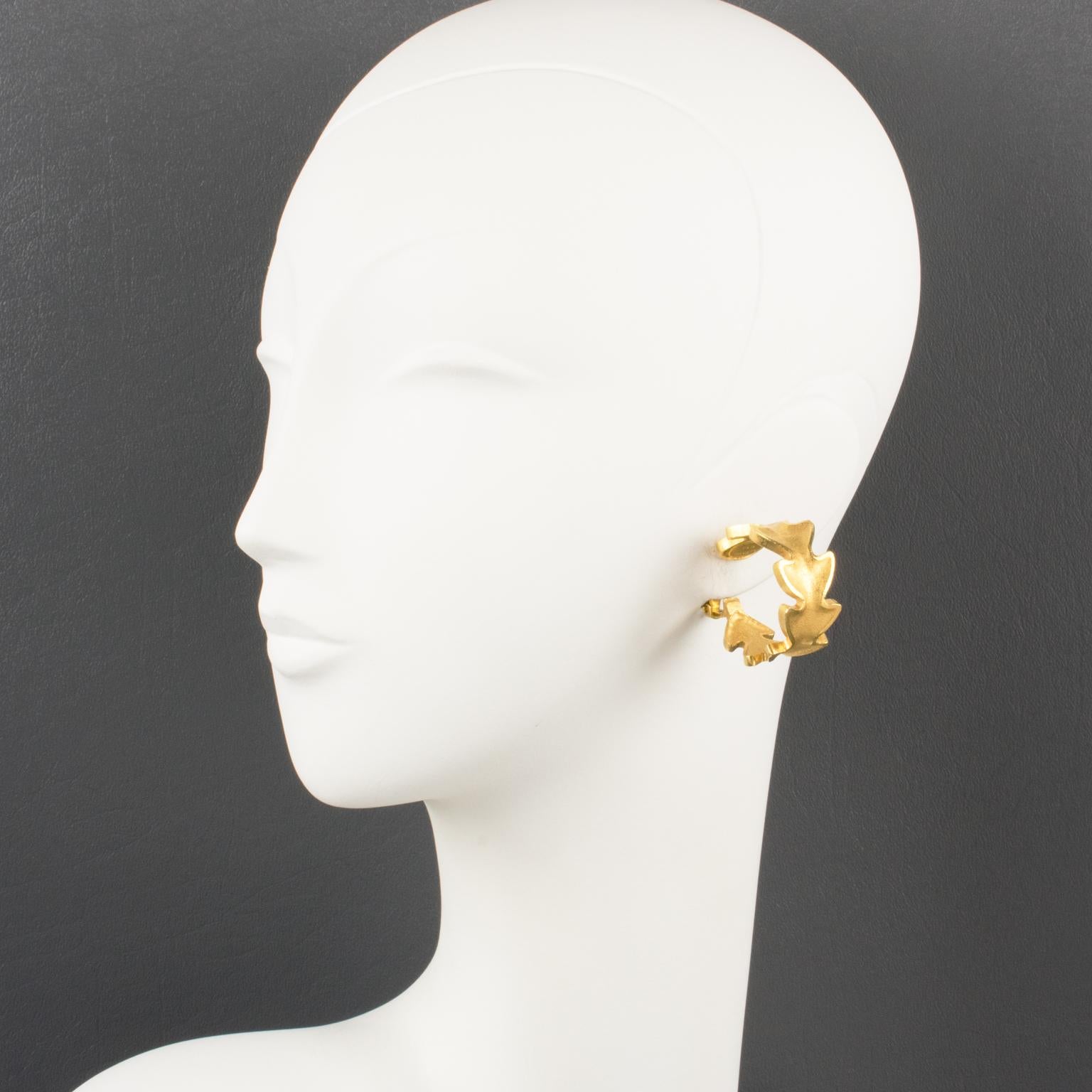 Superb Lanvin Paris gilt clip-on earrings. Large hoop shape with gilt metal all textured and matte finish aspect, featuring carved stylized leaves. Gilded tag underside marked: Lanvin - Paris. 
Measurements: 0.63 in. wide (1.5 cm) x 1.25 in. deep