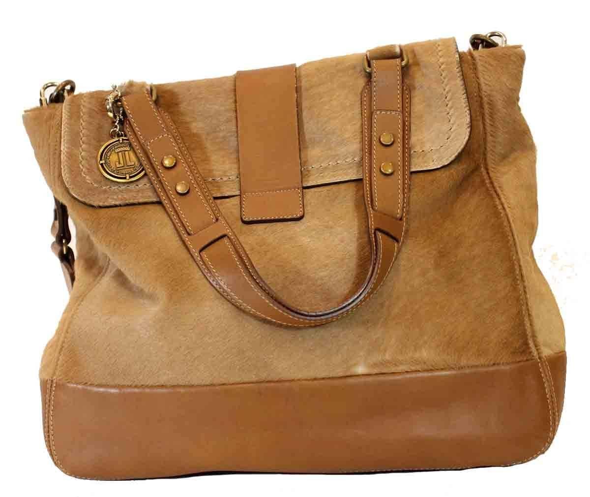 Tan leather and camel calf hair. Bronze and gold hardware. Twist lock at fold-over flap. Top handle. Detachable shoulder strap. One interior zippered pocket.