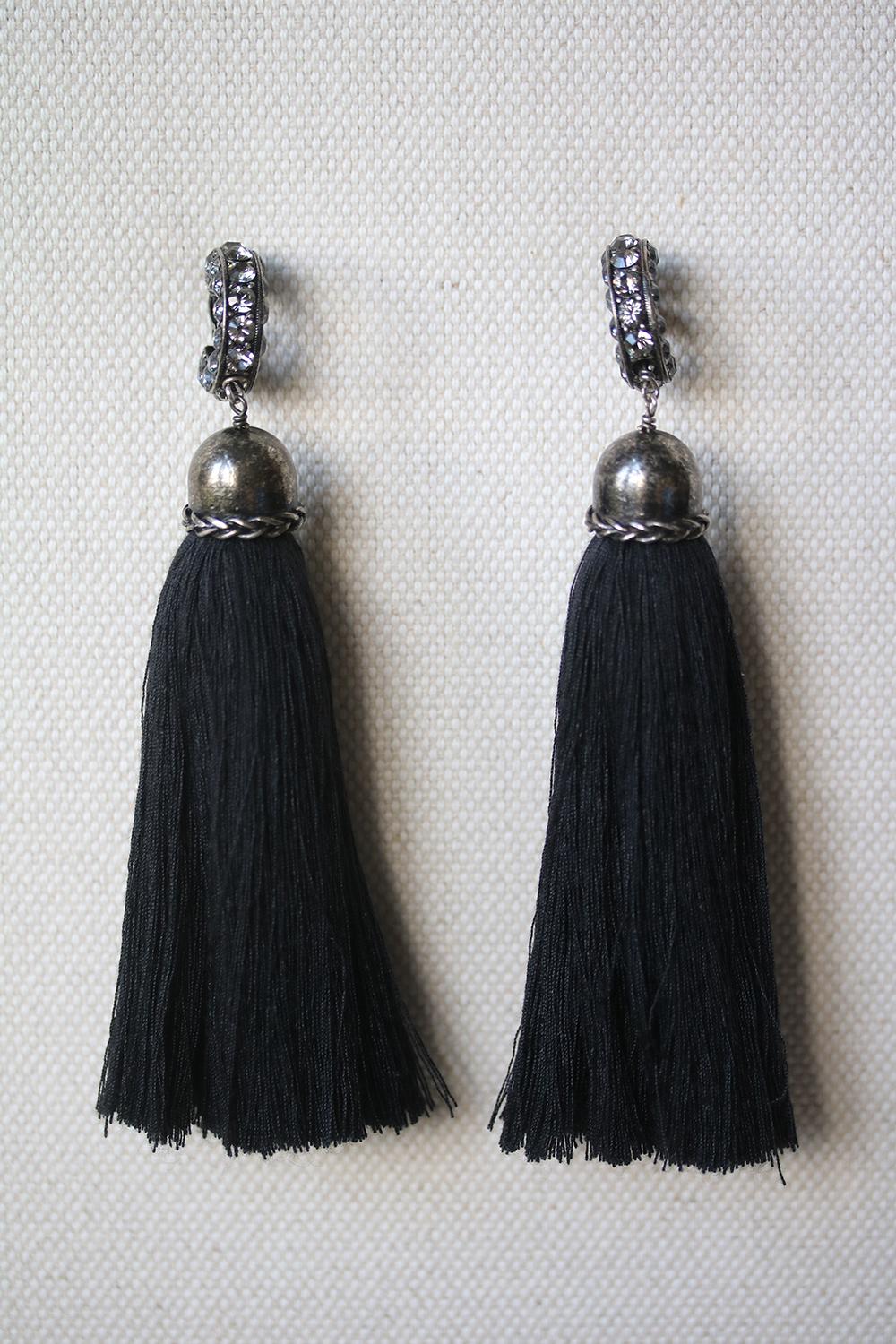 Lanvin's ornamental earrings are a key accessory from the label's collection. Crafted with twisted gunmetal-tone brass clip on hooks and enameled crystals, they are finished with shoulder-grazing navy tassels that swish playfully as you walk. Color: