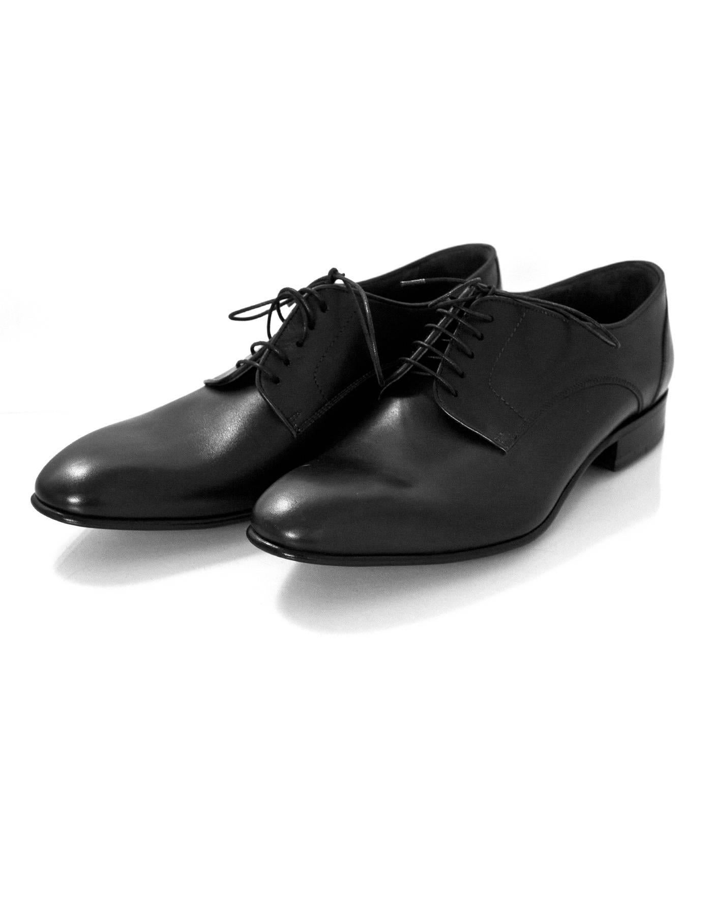 Lanvin Men's Black Leather Shoes Sz 8 NIB

Made In: Italy
Color: Black
Materials: Leather
Closure/Opening: Lace tie closure
Sole Stamp: Lanvin
Overall Condition: Excellent pre-owned condition
Included: Lanvin box, dust bags, extra laces

Marked