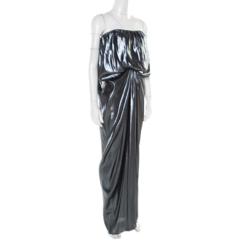 Glamorous and gorgeous, this Lanvin dress is sure to help you make a statement like never before! The metallic creation is made of a silk blend and features an artistically draped silhouette. Opt for side swept hair, diamond danglers, platform heels