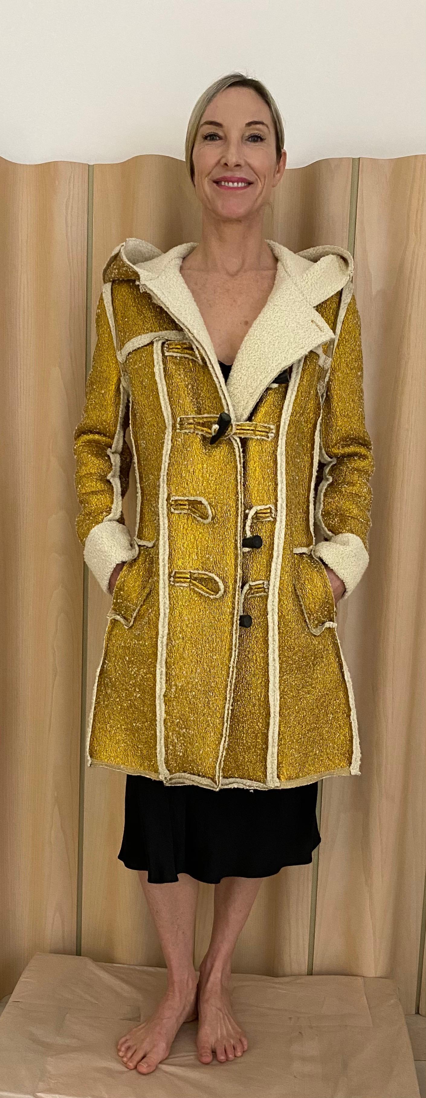 2015 LANVIN Metallic gold pea coat lined in shearling. Toggle buttons. Hooded coat.
coat has pockets.
fit size 4/6
Coat in excellent condition 