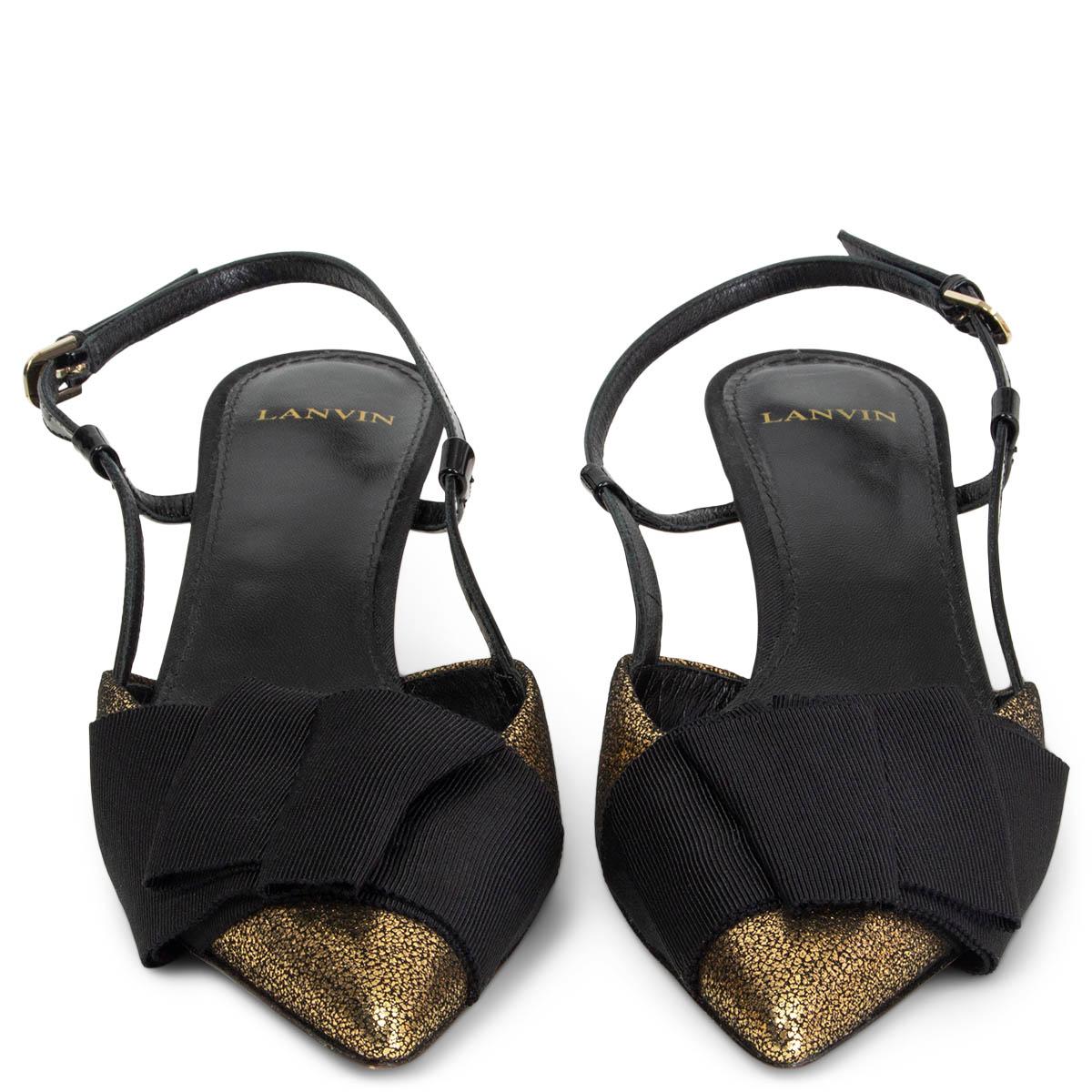 100% authentic Lanvin grosgrain bow embellished slingback pumps in black and cracked metallic gold-tone leather. Slingbacks feature an architectural faceted kitten heel. Have been worn once inside and are in virtually new condition. Come with dust