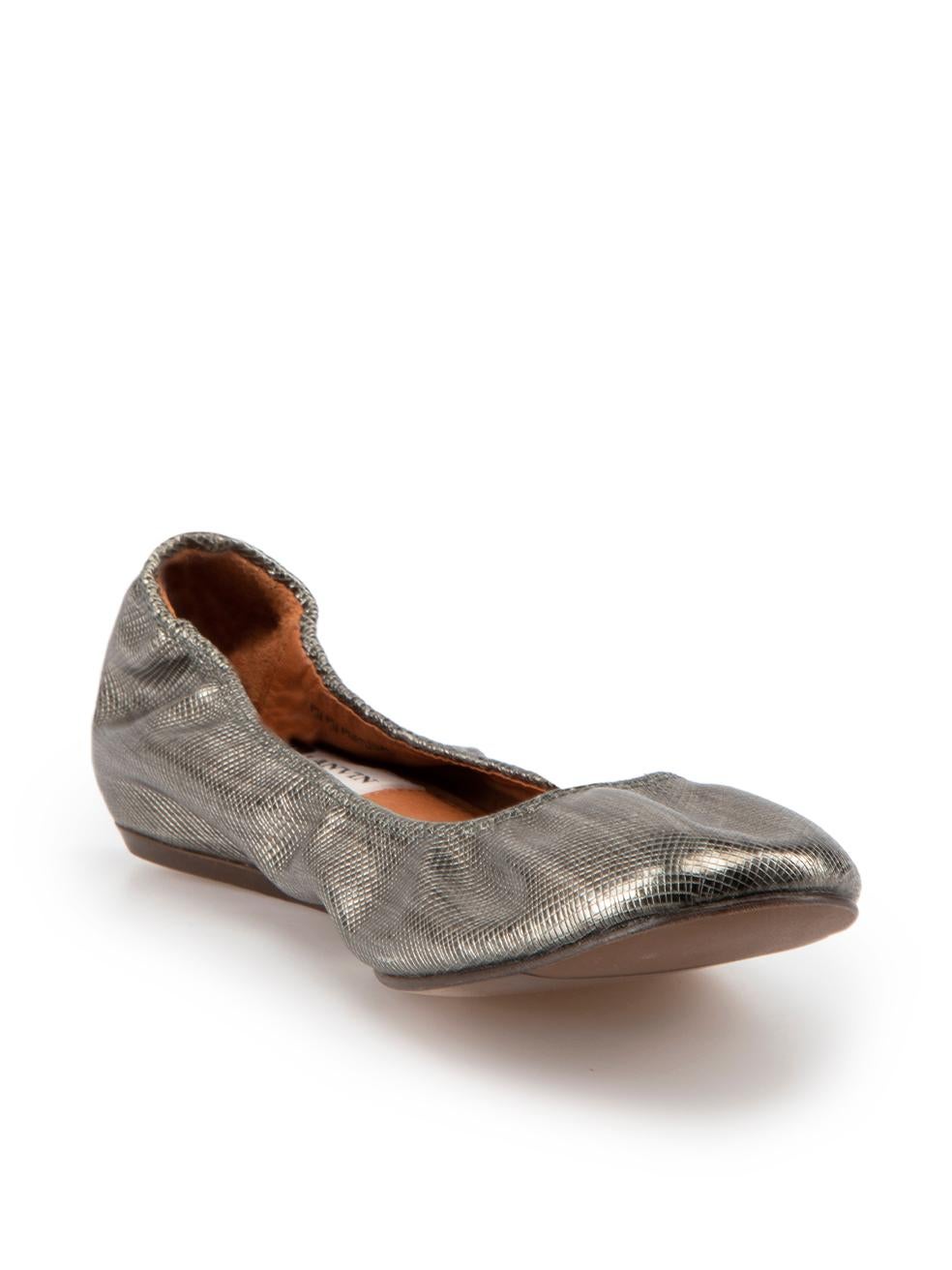 CONDITION is Good. Minor wear to flats is evident. Light wear to uppers with minimal abrasion of leather finish found around the top line, hardly any scuffing seen on the outsoles of this used Lanvin designer resale item.

Details
Silver