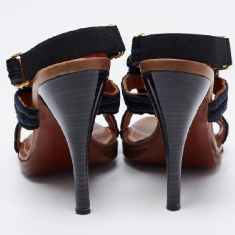 Sing the tune of the season with this gorgeous pair of sandals from Lanvin. They are crafted from braided fabric and are decorated with crystal embellishments. Open toes, slingbacks, and 11.5 cm heels make the sandals ready to be worn by you.