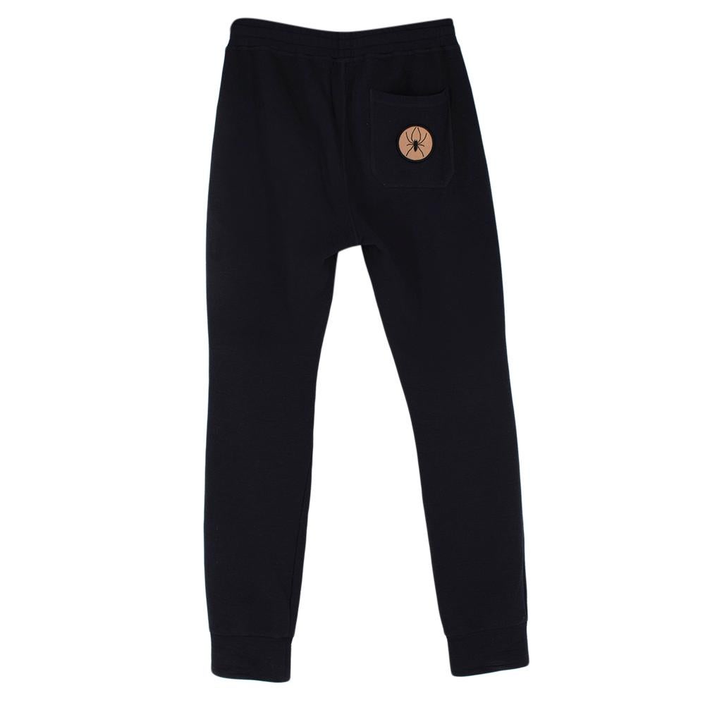 Lanvin Navy Cotton Spider Patch Sweatpants 

-Crafted from cotton French terry for an incredibly soft touch
-Gorgeous graphic spider and star patches  
-Elasticated waist 
-Pockets to the sides 
-Adjustable waist 
-Pocket to the back 
-Timeless