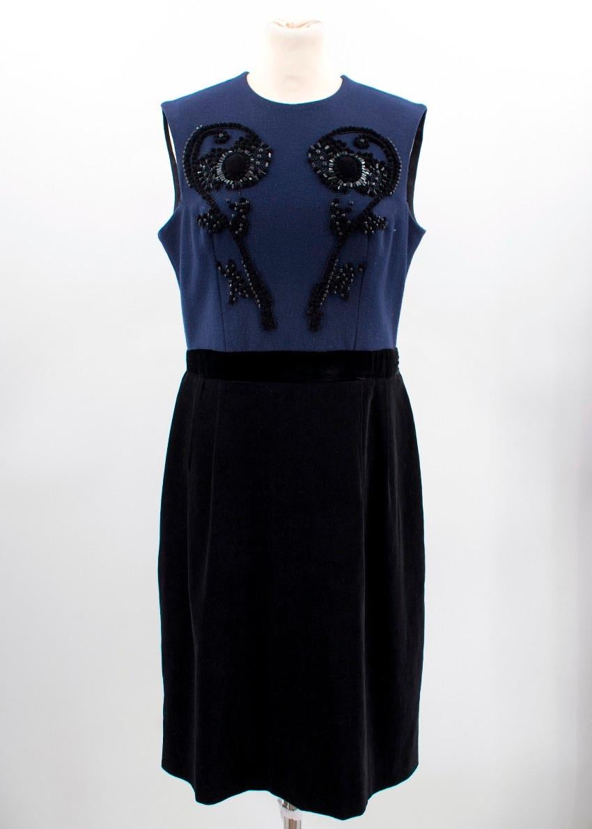Lanvin Navy Dress

- Navy blue top with velvet embellishments 
- Velvet bottom section to the dress
- Exposed zip
- Velvet waistband belt

Measurements are taken laying flat, seam to seam. 
Shoulders: 37cm
Length: 105cm