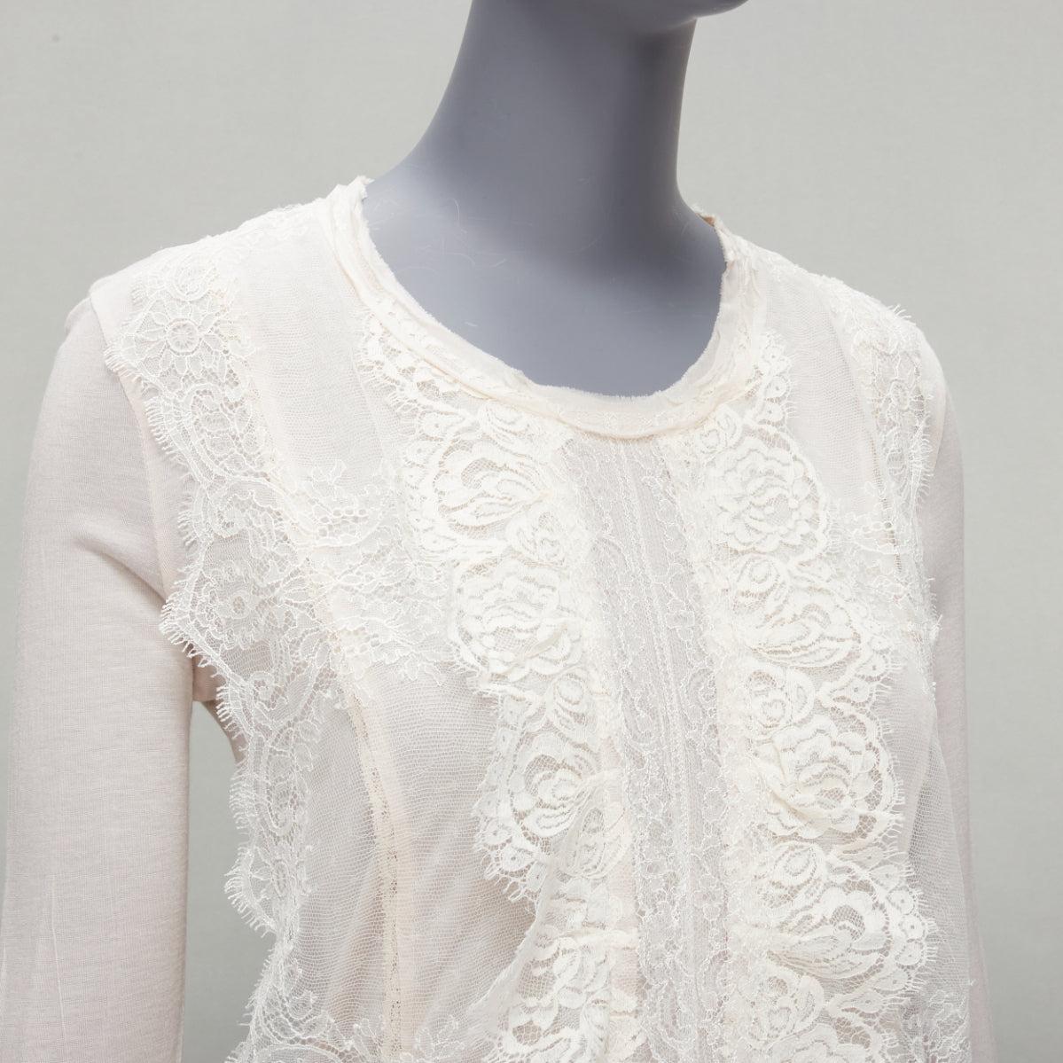 LANVIN off white lace overlay asymmetric cropped 3/4 sleeve top FR32 XXS
Reference: SNKO/A00231
Brand: Lanvin
Designer: Alber Elbaz
Material: Viscose
Color: Off White
Pattern: Solid
Closure: Pullover
Made in: India

CONDITION:
Condition: Very good,