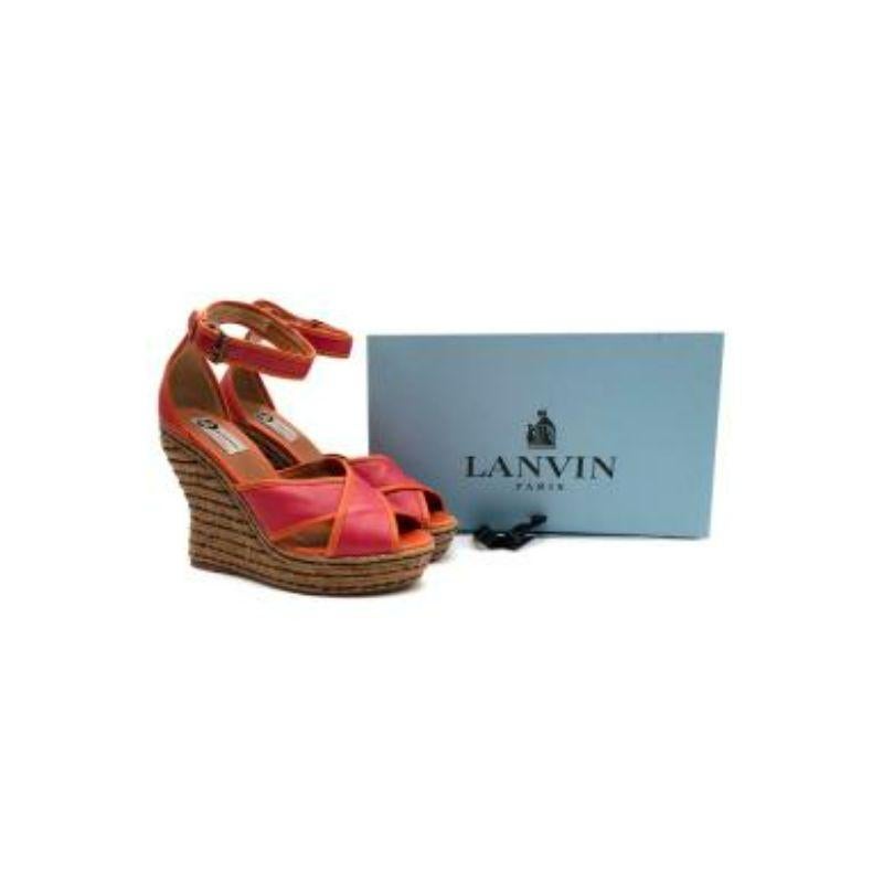 Lanvin Orange and Pink Espadrilles Wedgers

- Adjustable ankle fastening with buckle
- Open toe
- Leathered and branded insole
- Black striped detail wedge

Material
Jute and Leather

Made in Spain

9.5/10 Excellent condition

PLEASE NOTE, THESE