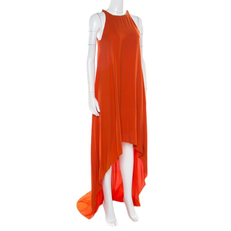 This vibrant orange dress from Lanvin is sure to set hearts racing! The high low dress is made of a silk blend and features a draped silhouette. It flaunts a halter neck that is detailed with gold-tone metal and comes equipped with button