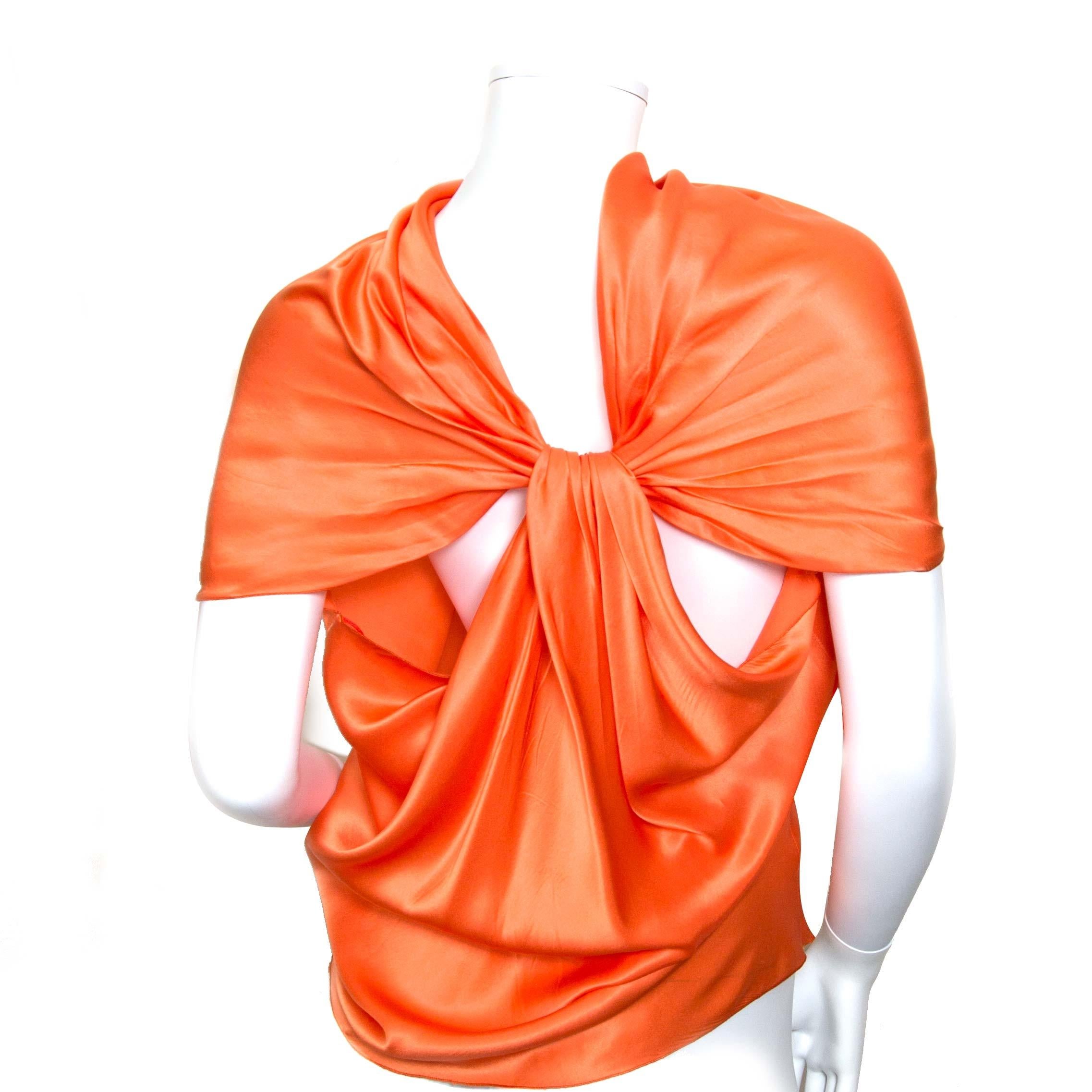 Very good condition

Lanvin Orange Silk Top

This 2010 top is perfect for hot summer days. This beautiful top is made out of 100% silk. 
The bright orange color will look beautiful on you with a nice summer tan. 