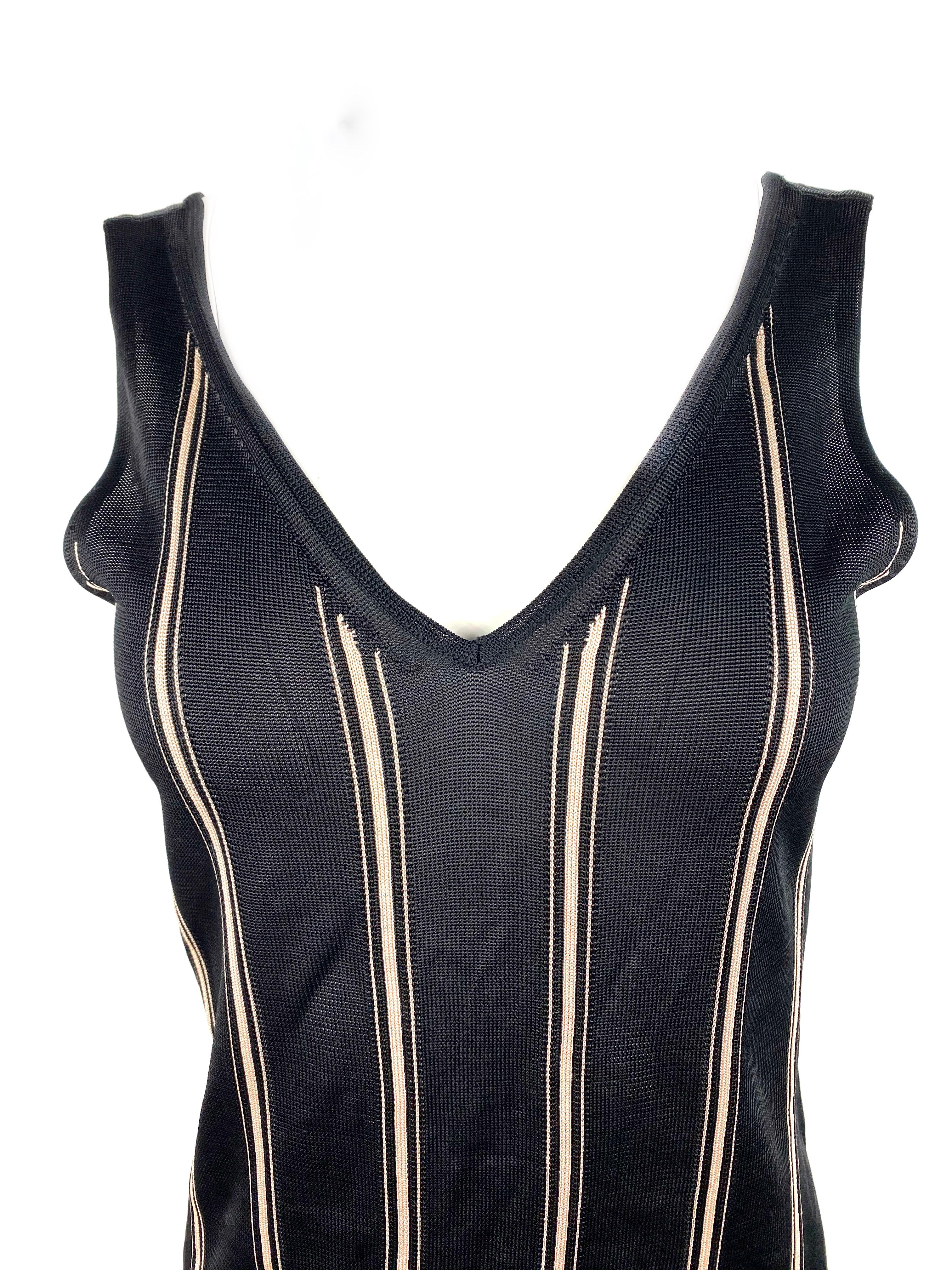 Product details:

Featuring black V- neck vest styled top with ivory/ cream horizontal striped pattern.
Made in Italy.